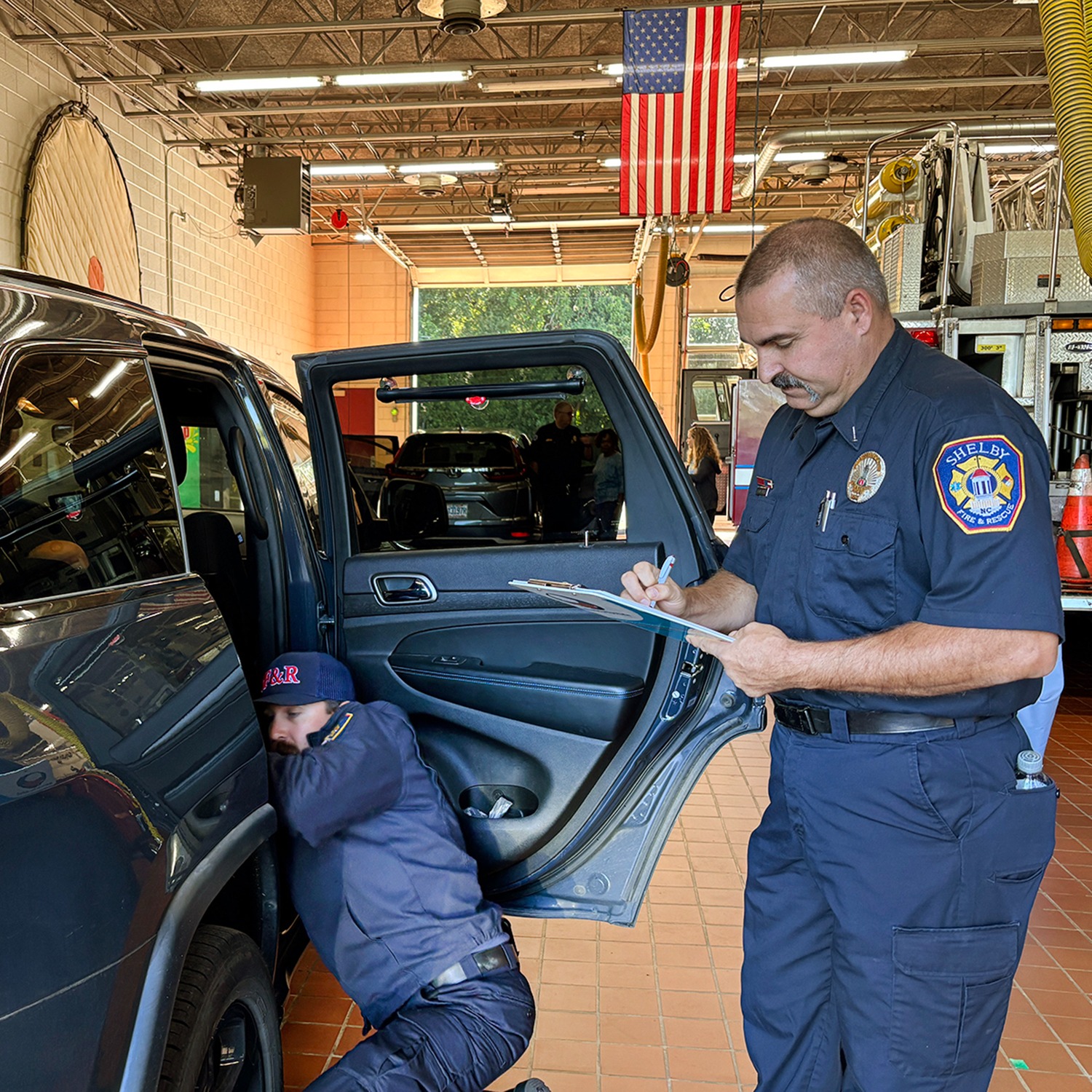 Shelby Fire and Rescue employees conducting car seat inspections 