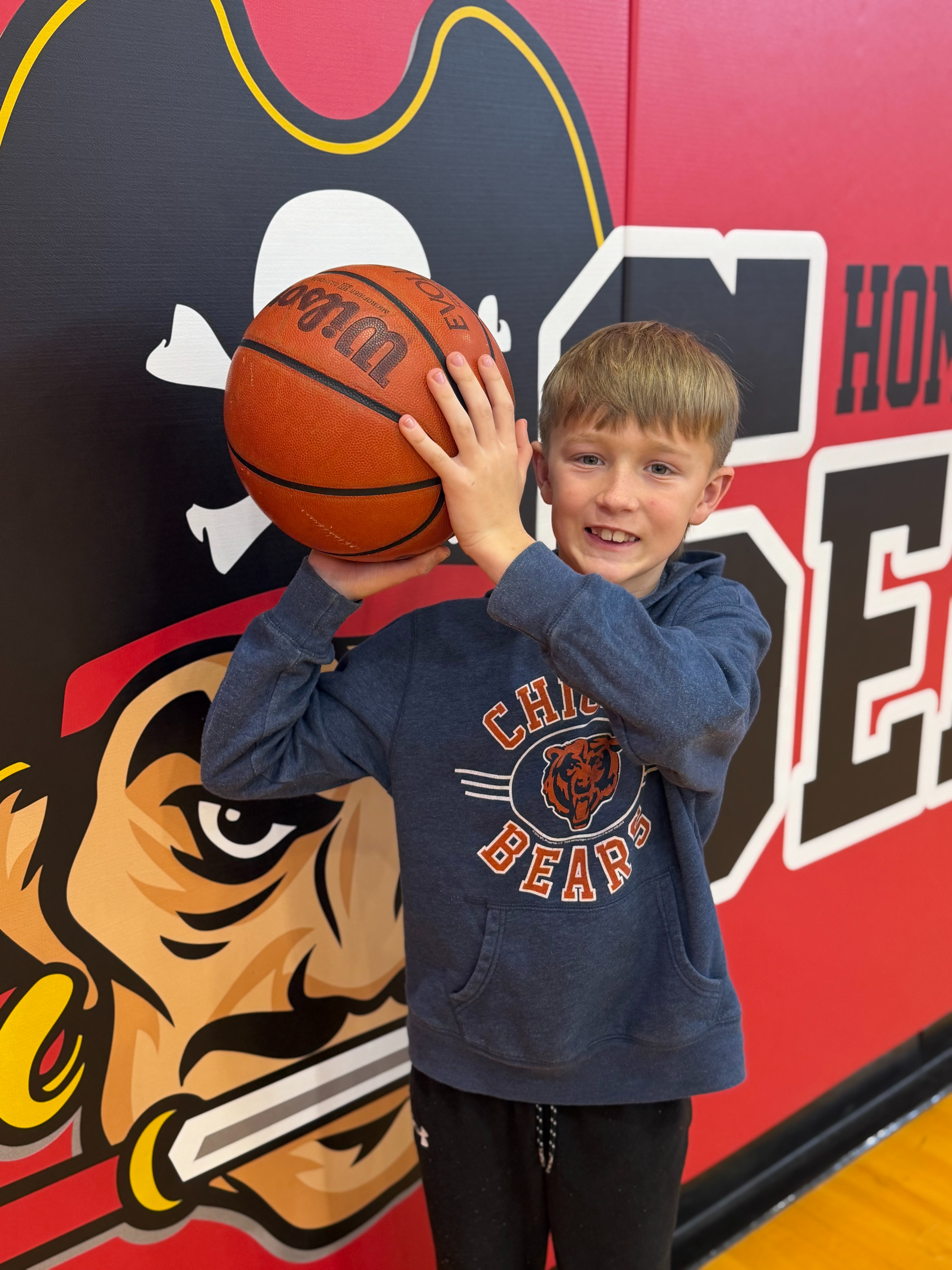 Male  Elementary Student Holding a basketball