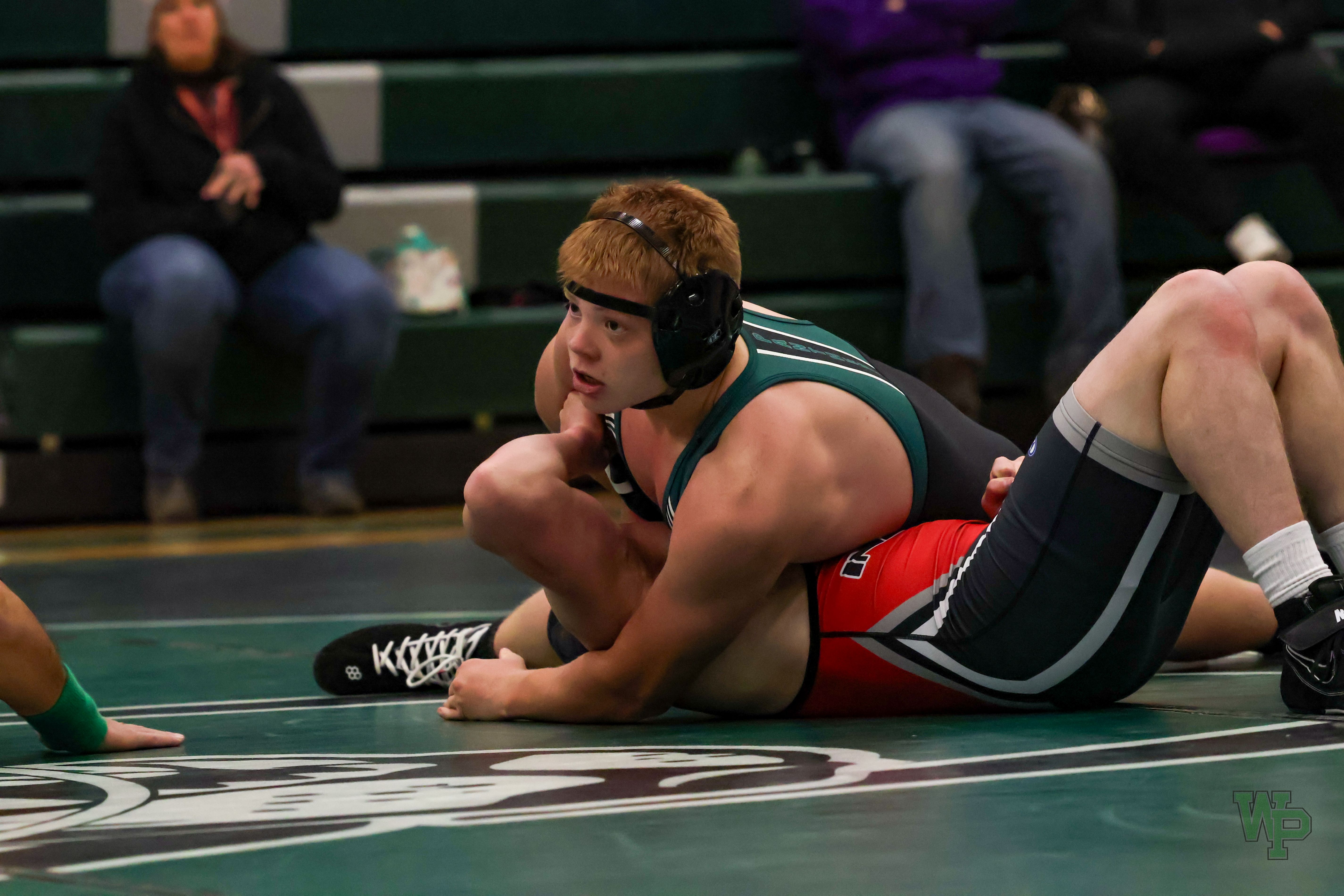 Wrestler pinning an opponent