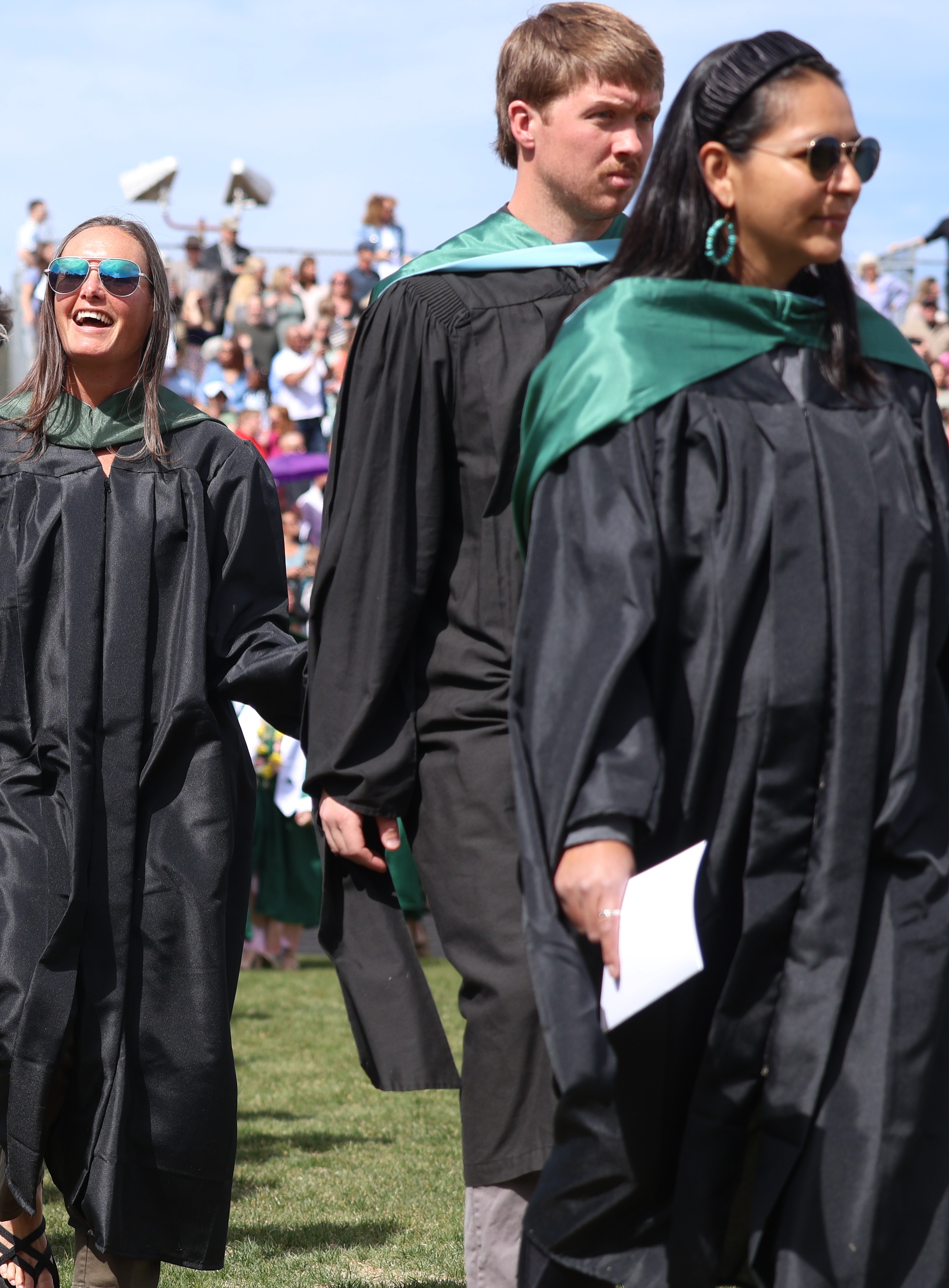 High school staff processing into the graduation ceremony