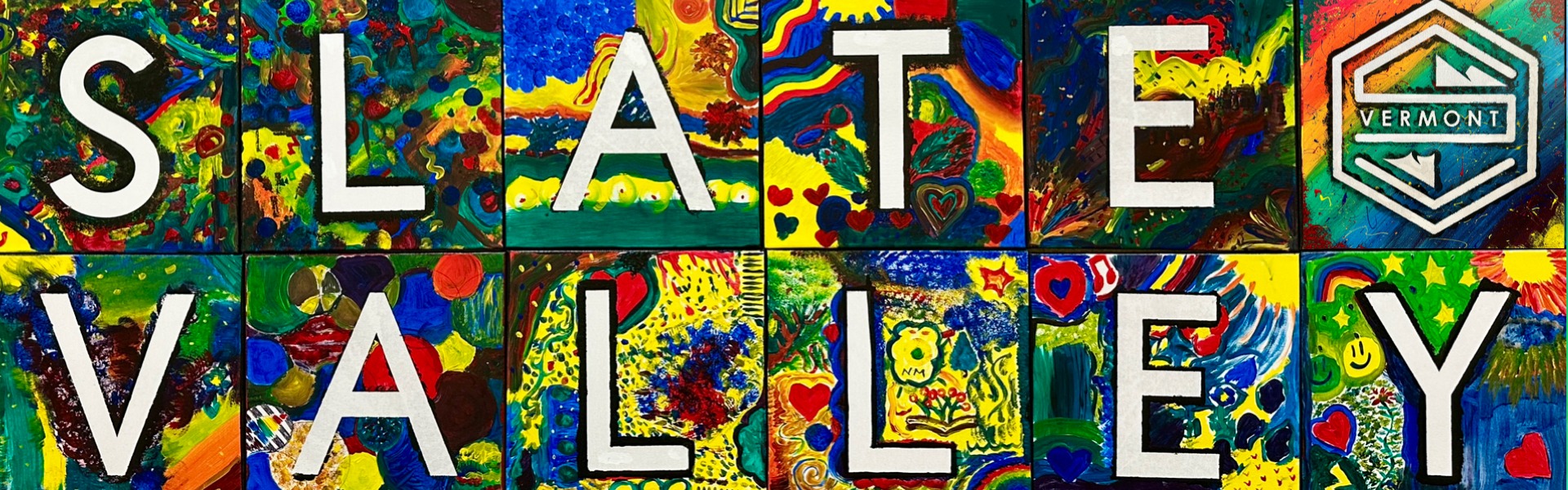 Colorful mural made up of painted squares with bold white letters spelling “WE ARE SLATE VALLEY.” Each square features unique student artwork with bright patterns, flowers, hearts, and abstract designs.