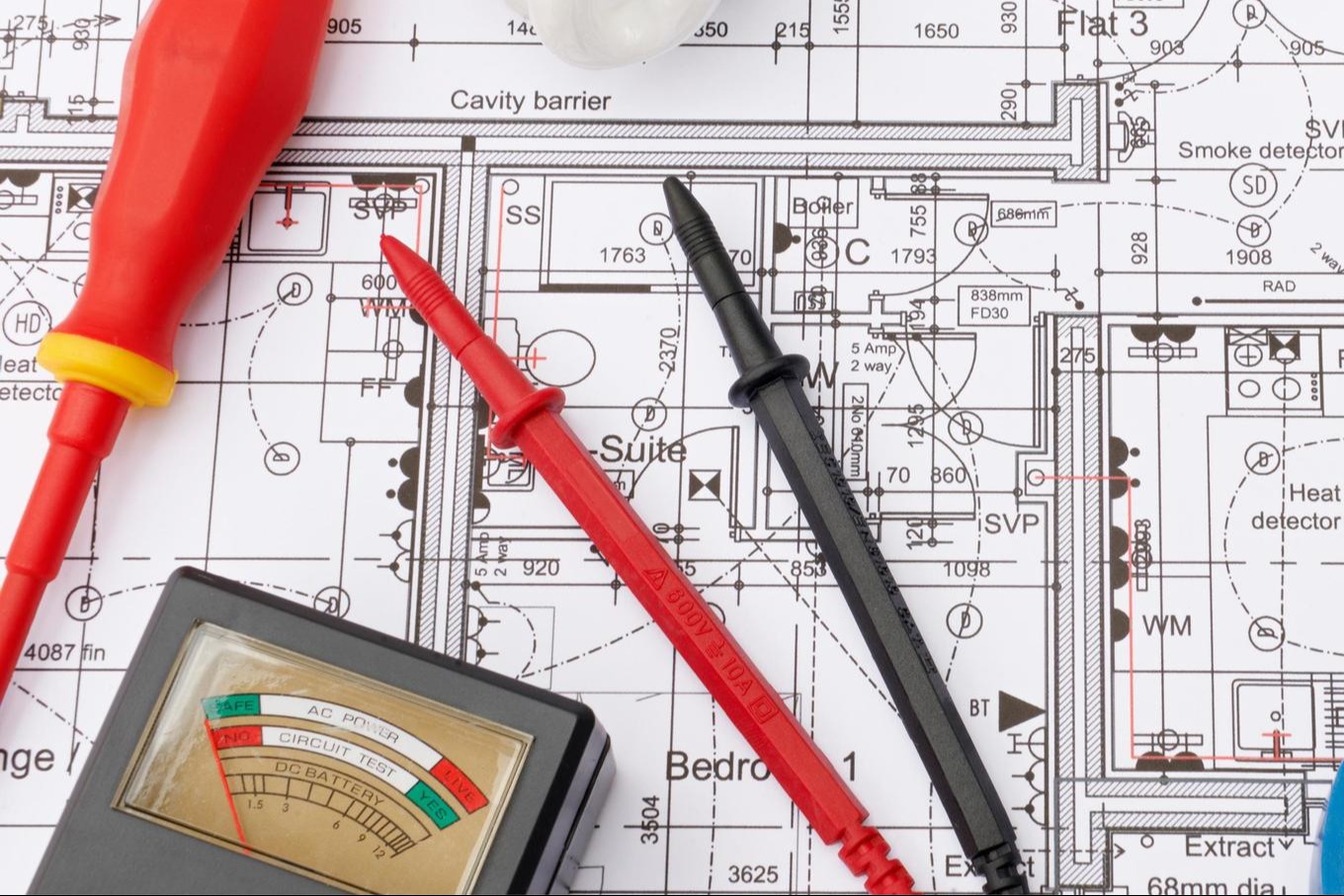 multimeter over electrical plans