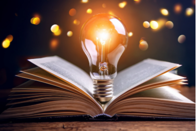 A lightbulb inside a book.