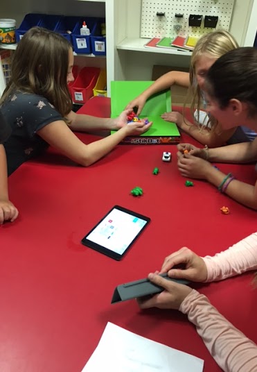 Students learning how to use the green screen in the MakerSpace with Mrs. Boemmels