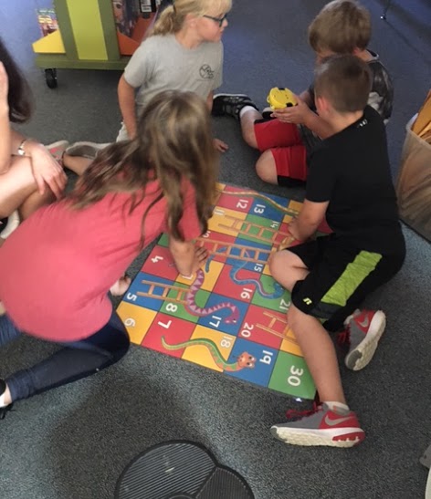 Students practicing coding with BeeBot in the MakerSpace with Mrs. Boemmels