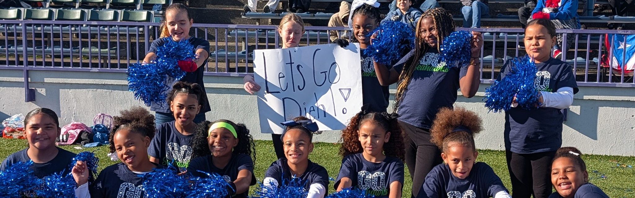 Group of students cheering for their school.