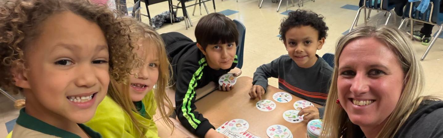 Kids and women smiling. 