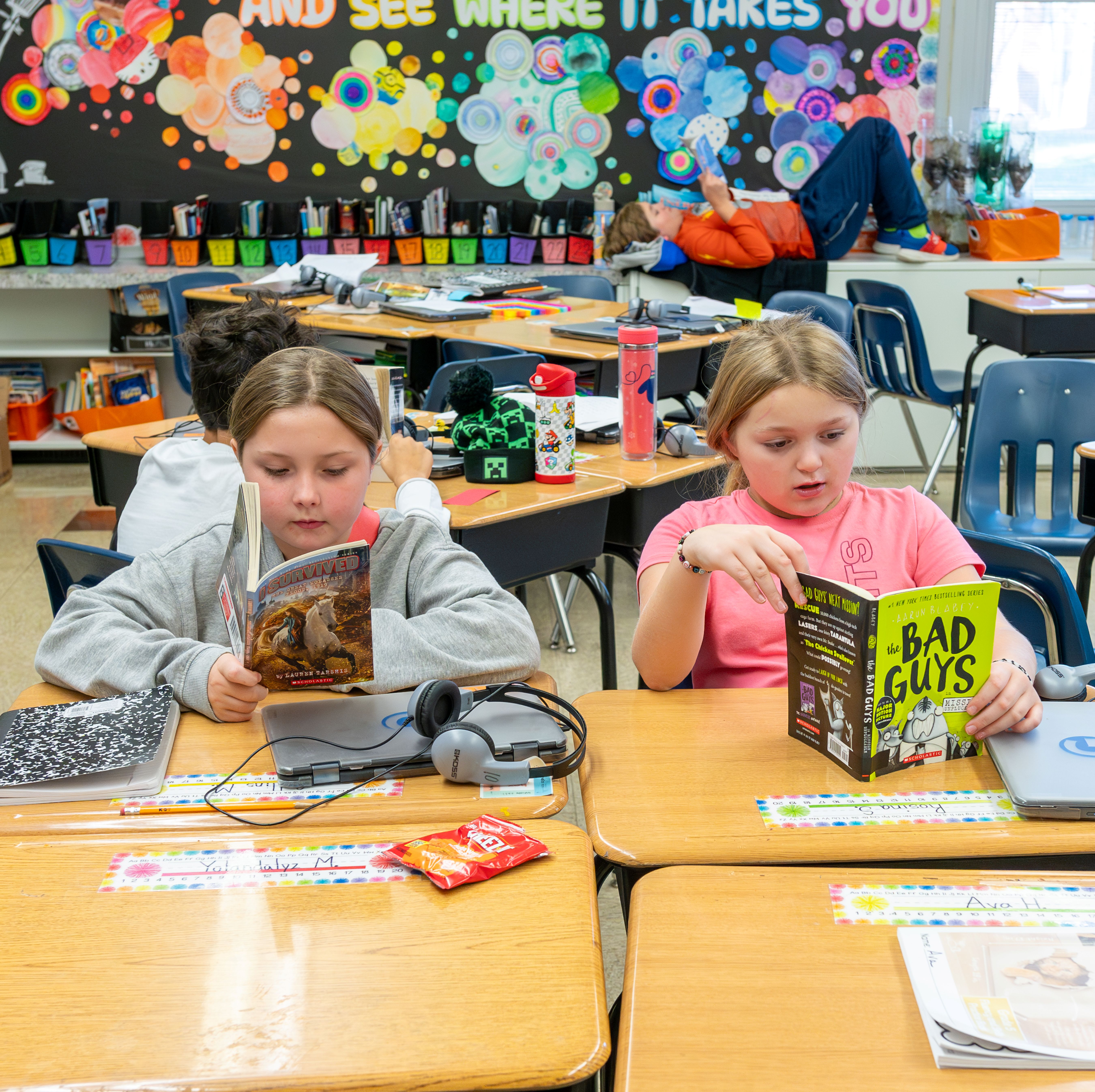 Girls reading at desk