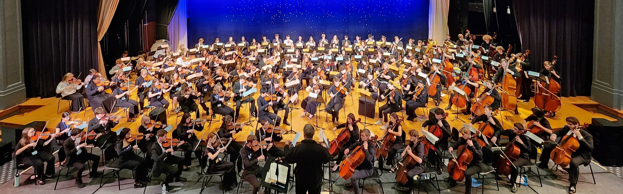 A stage with an orchestra on it.