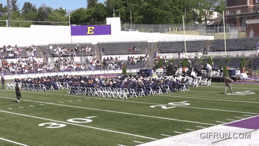 Collegiate Academy grads throw their caps at the end of the 2026 commencement ceremony