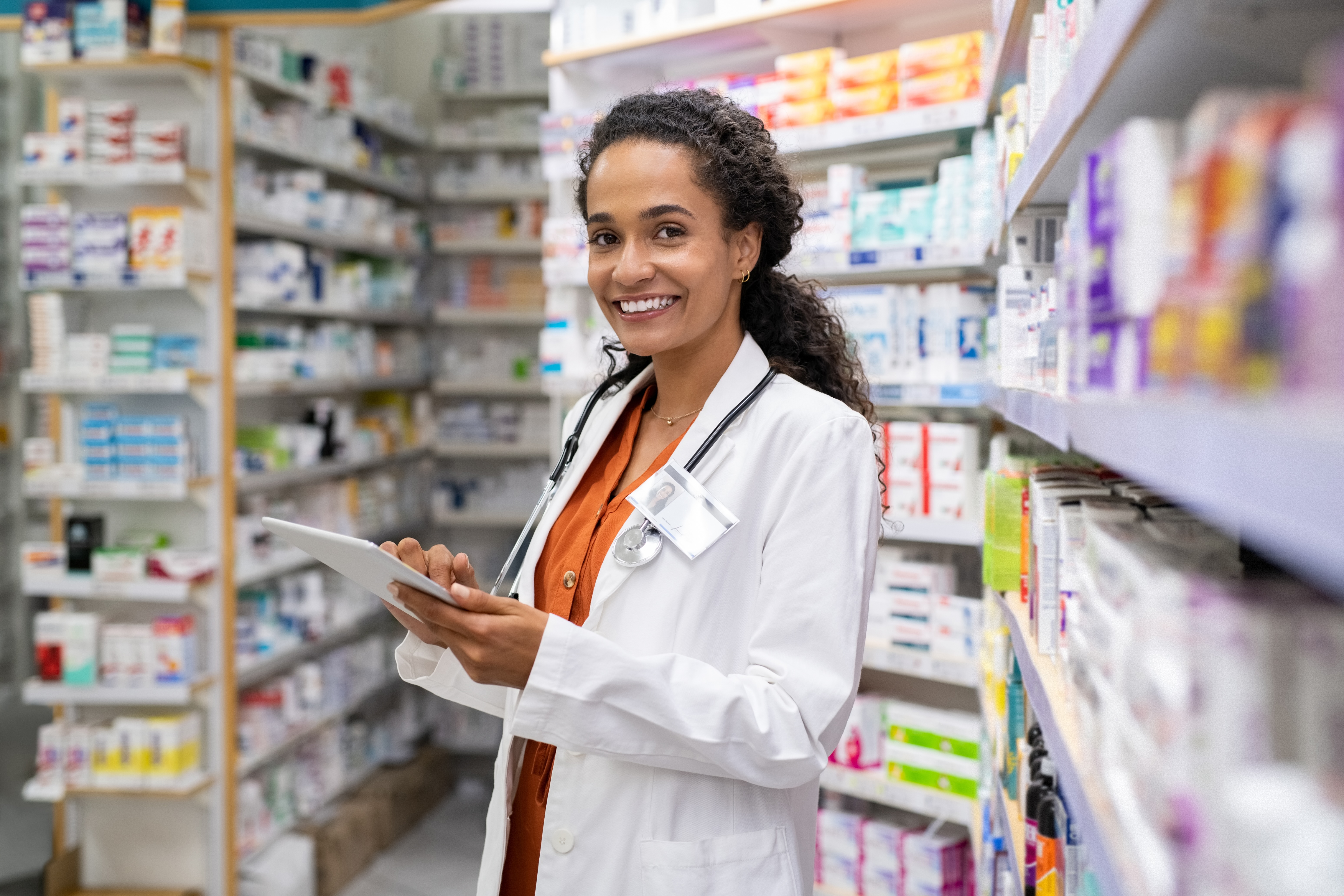 pharmacist holds a clipboard