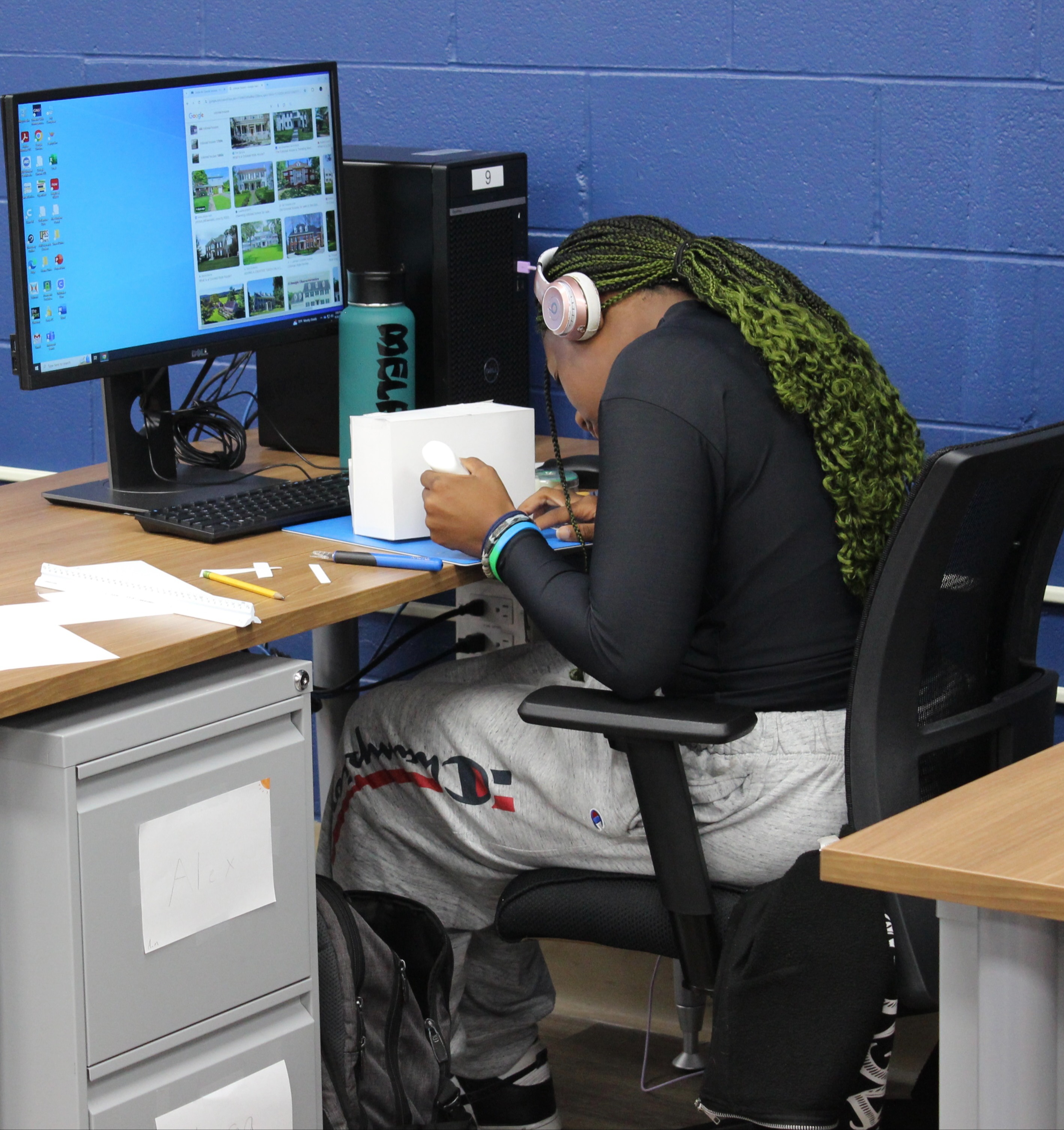 student at workstation in architecture classroom