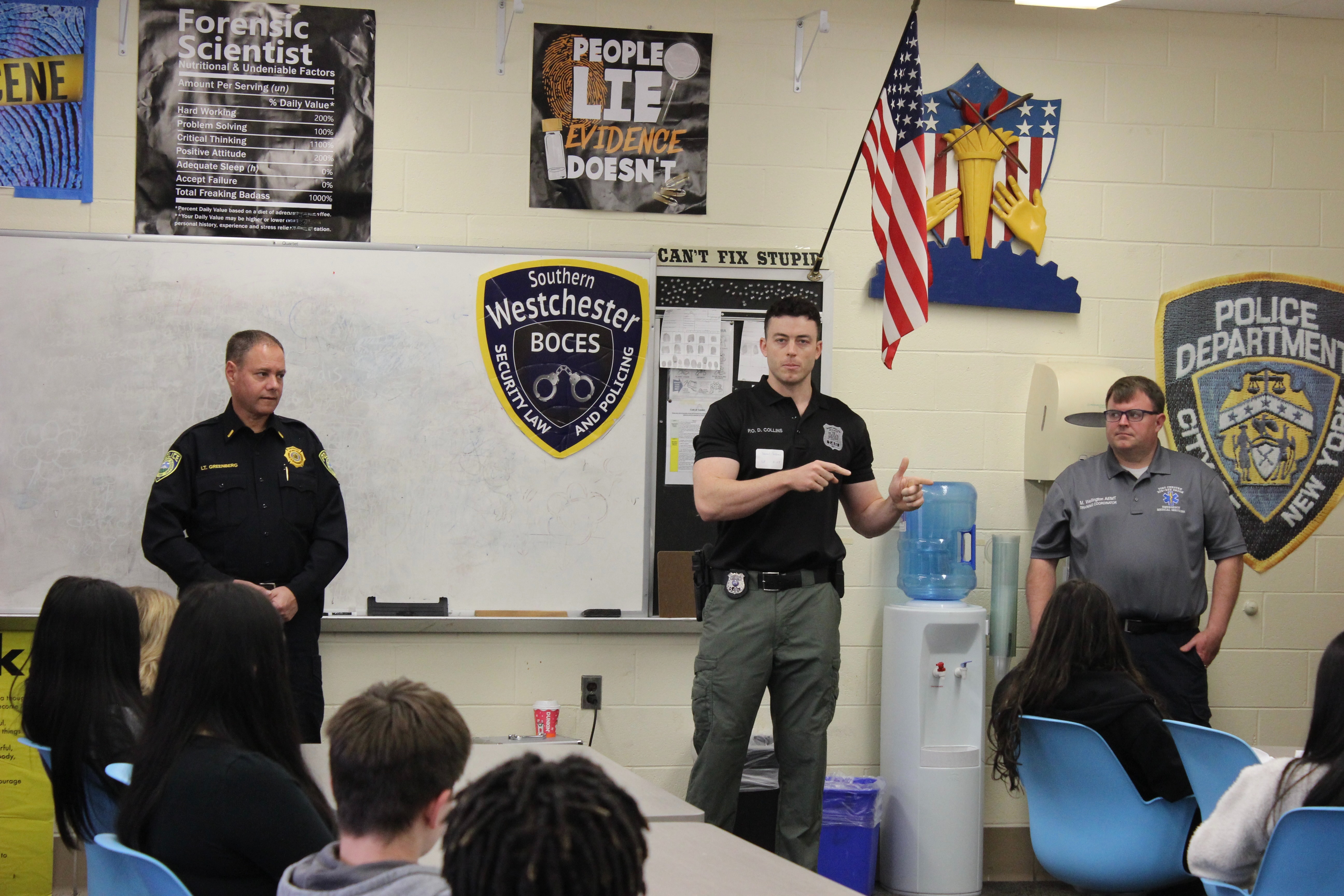 law enforcement officers lecture to students in Security, Law & Policing class