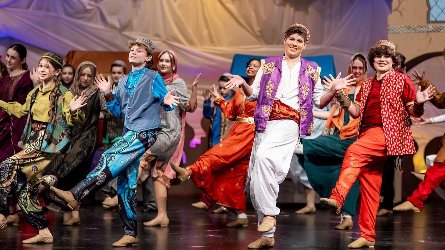 students performing Aladin on stage
