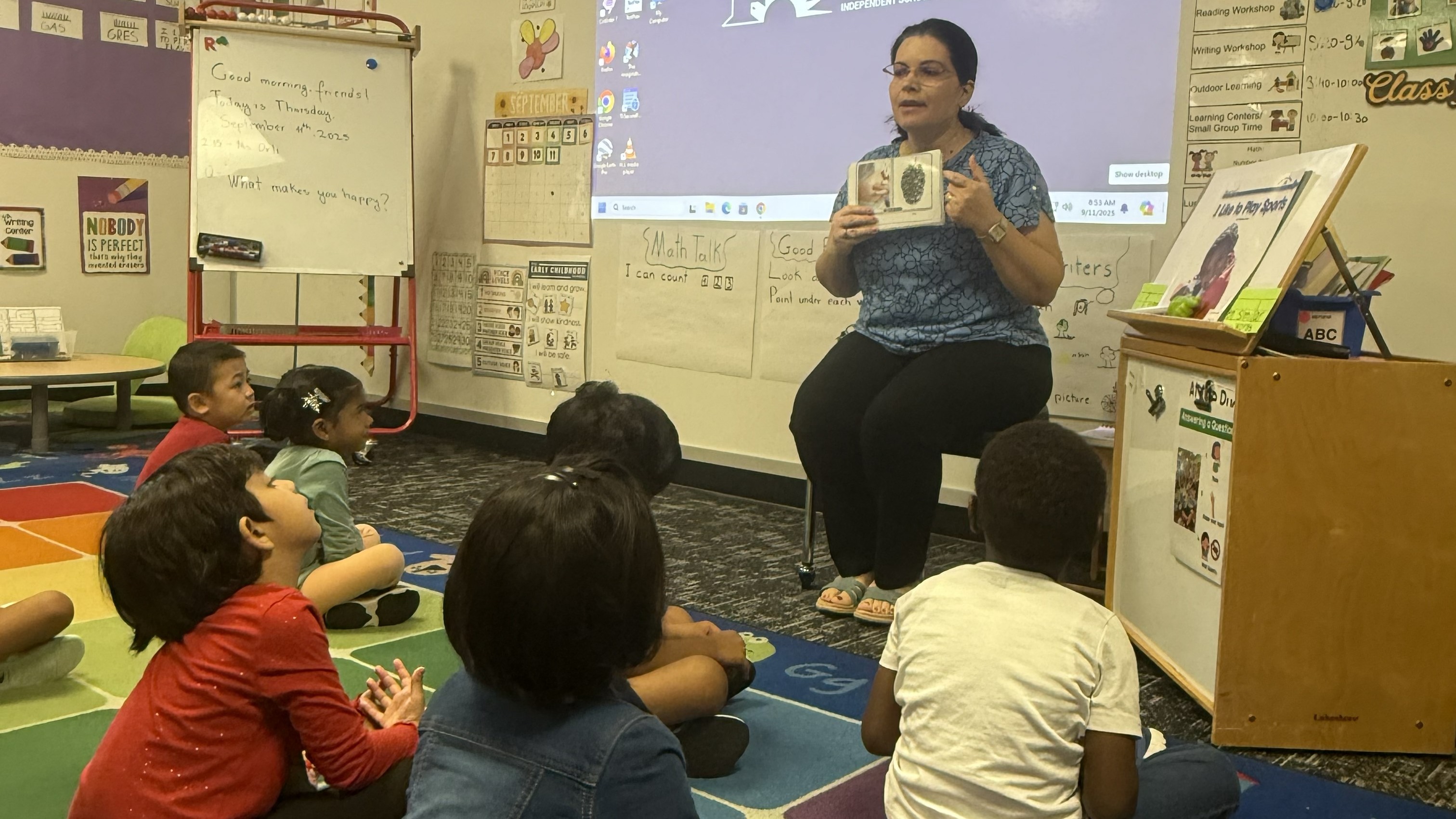 Teacher pointing to picture for students