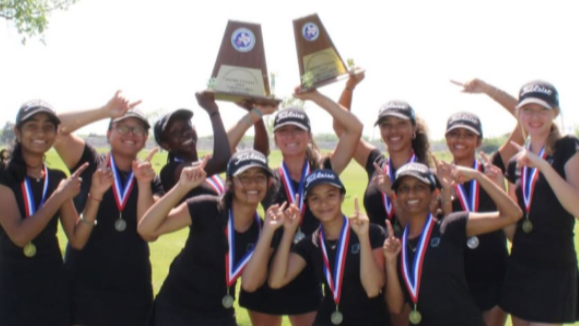 student athletes holding trophies