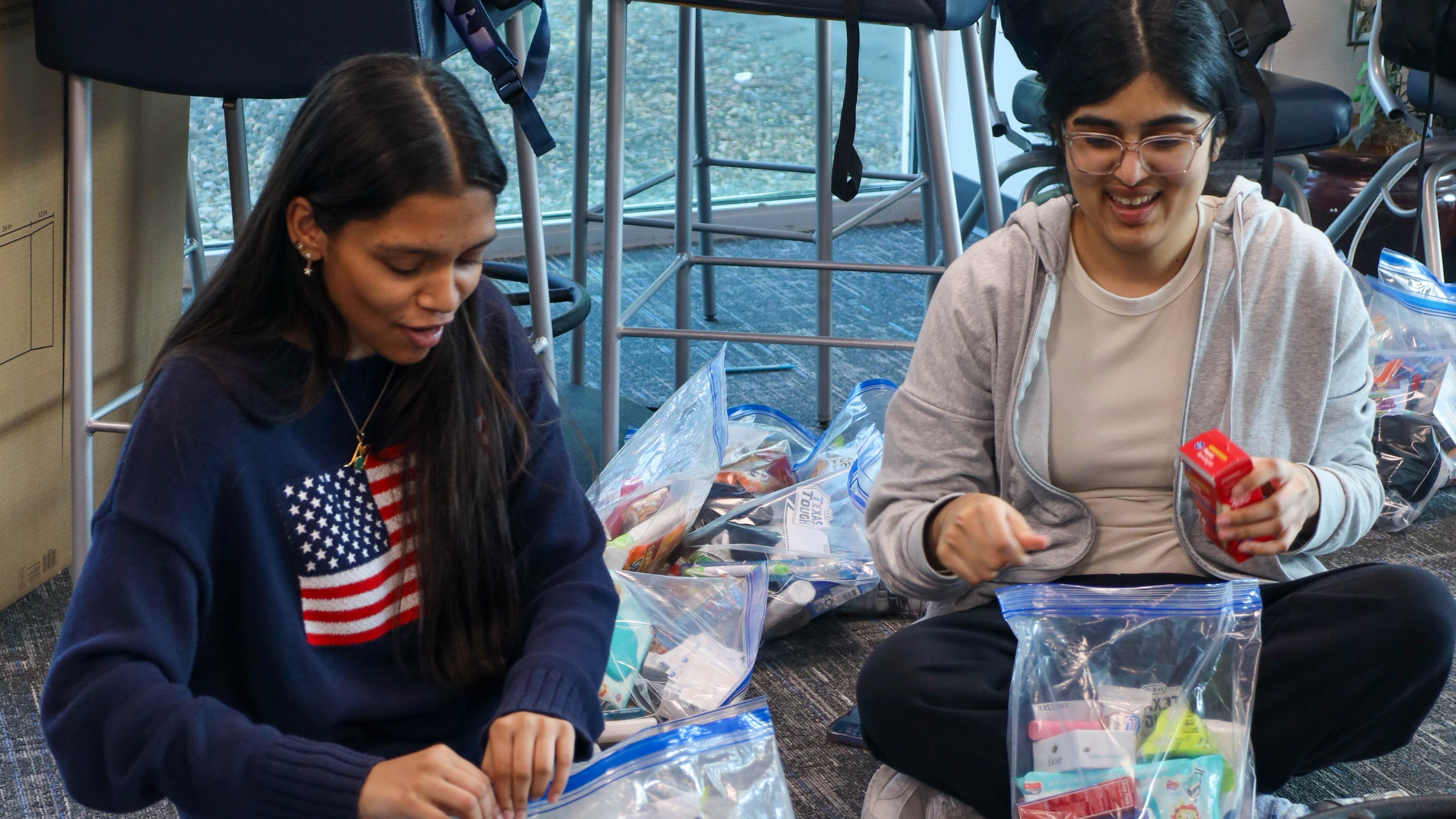 Students packing bags for donation