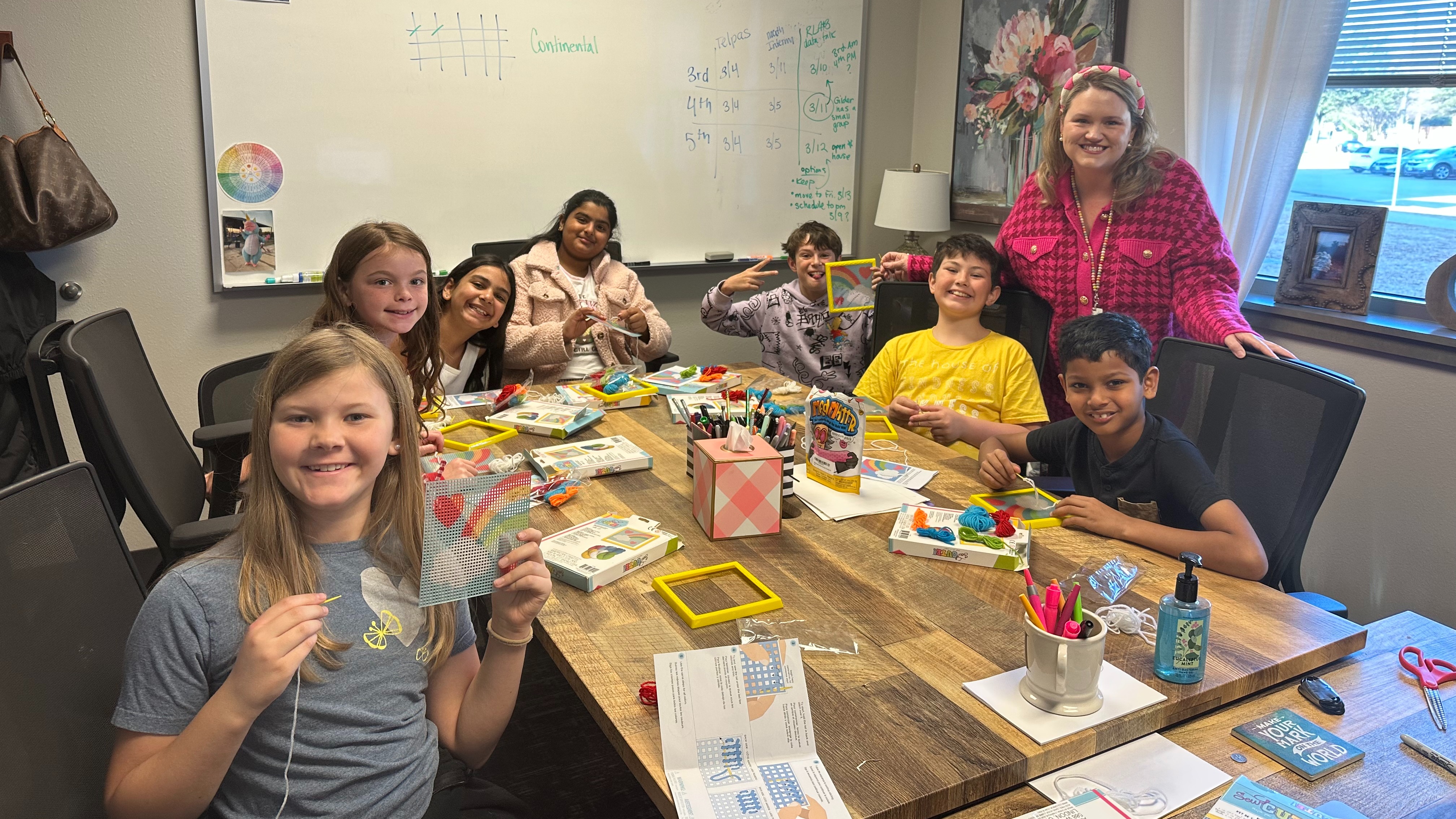 Students needlepointing in a small group