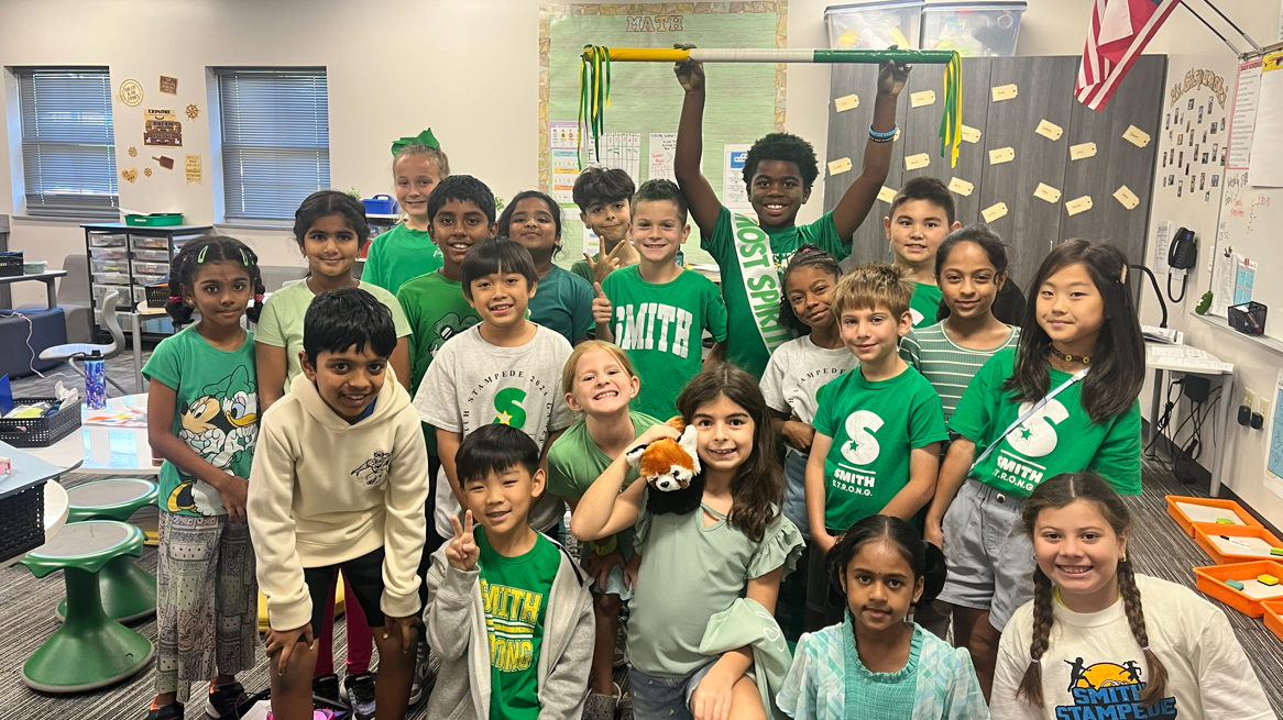 classmates posing with Most Spirited award winner
