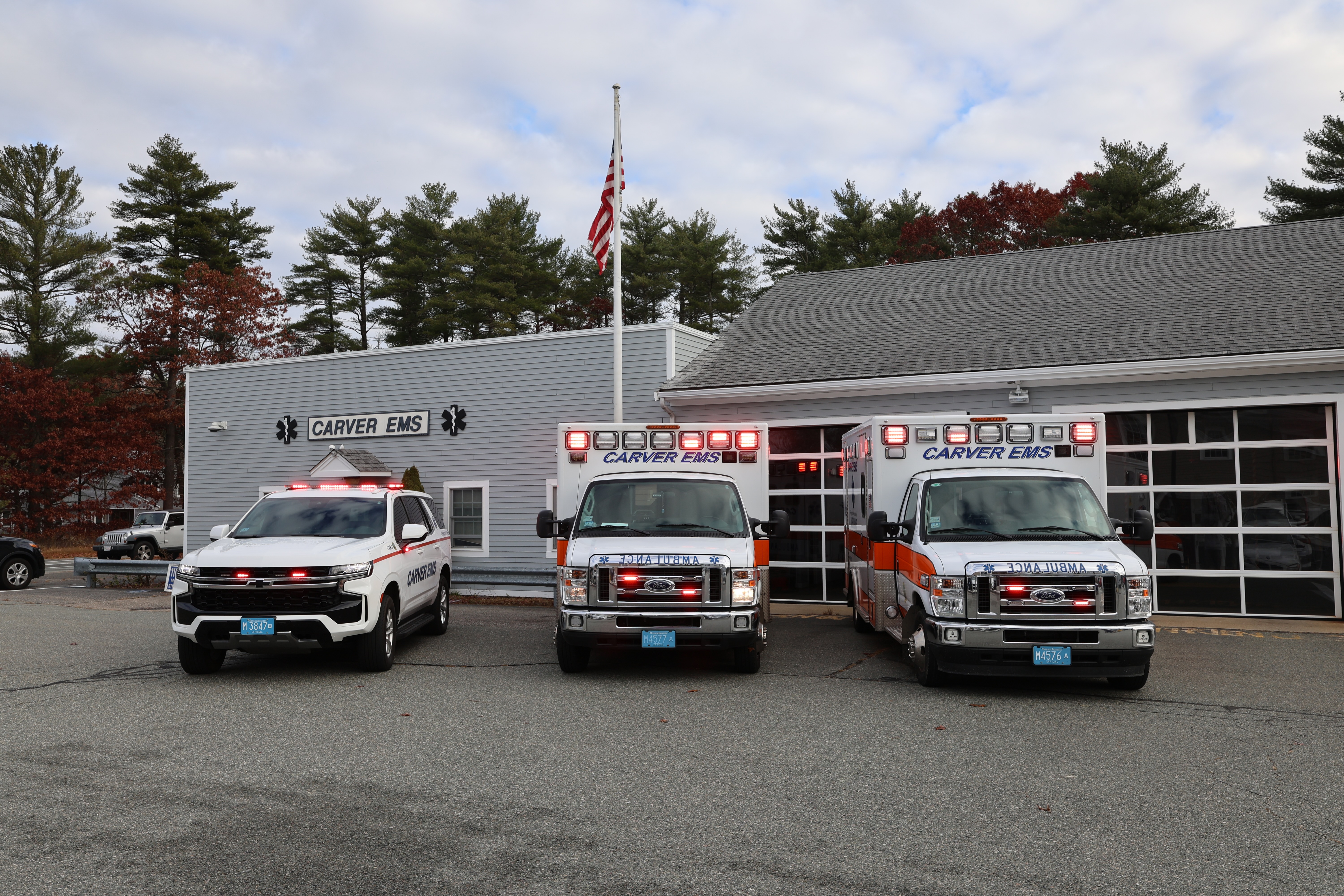 three ambulances outside of the building