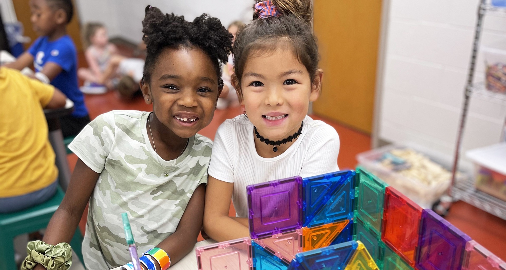 Two students pose for a photo