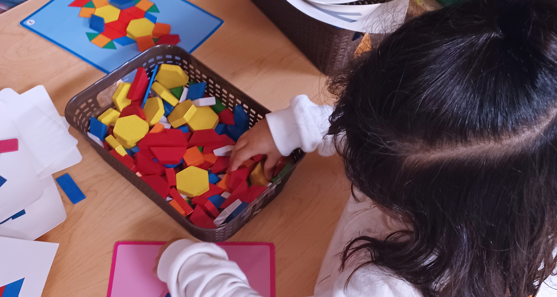 student playing with shapes