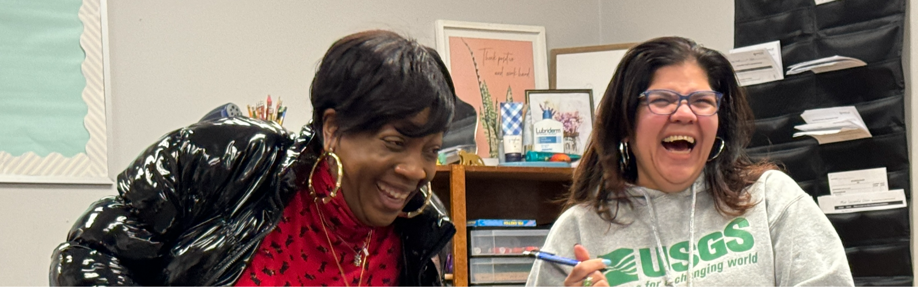 Two parents laughing at Positive Outcomes Charter School ParentCamp