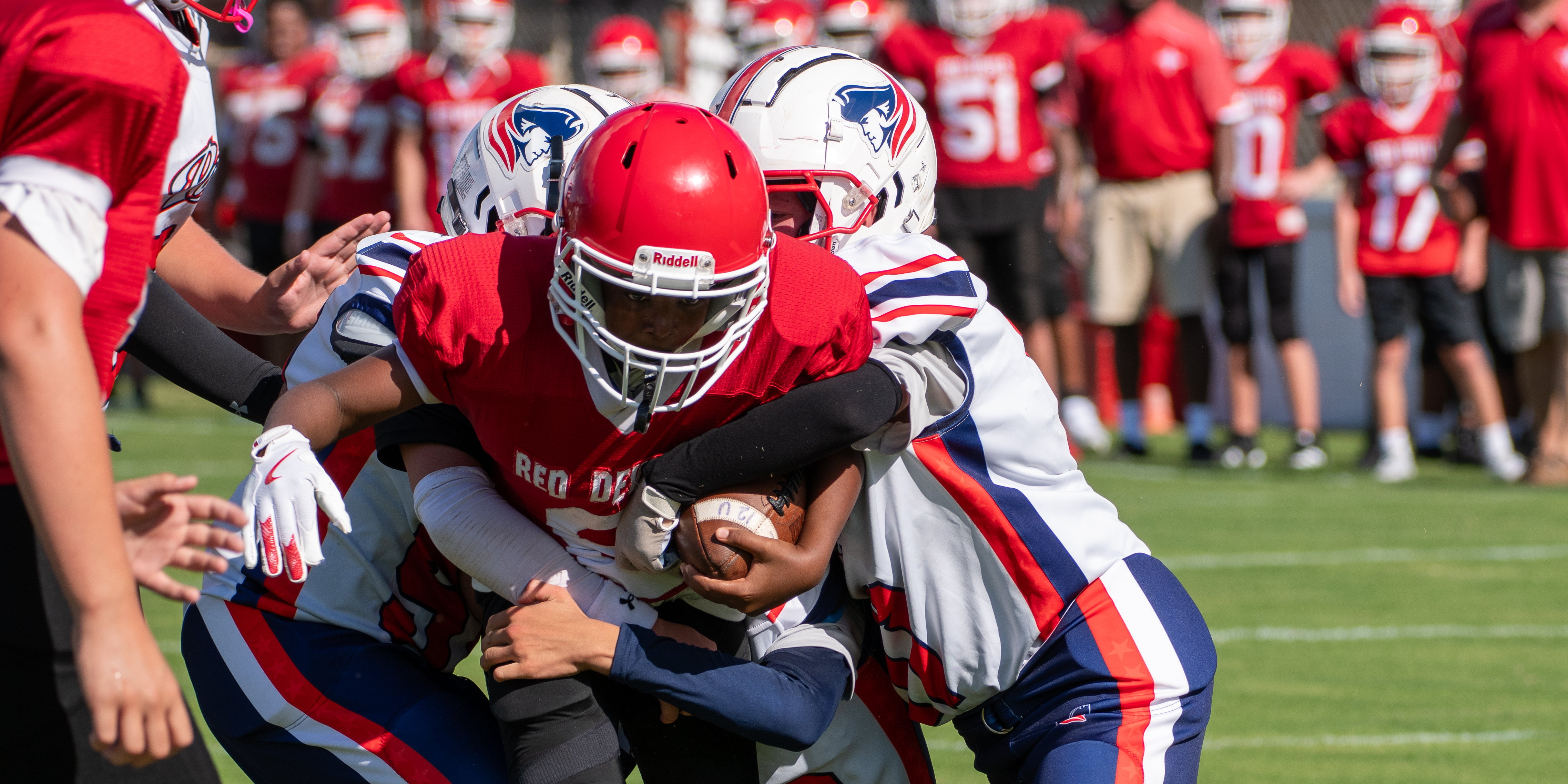 LCMS football player runs through tackle for touchdown.