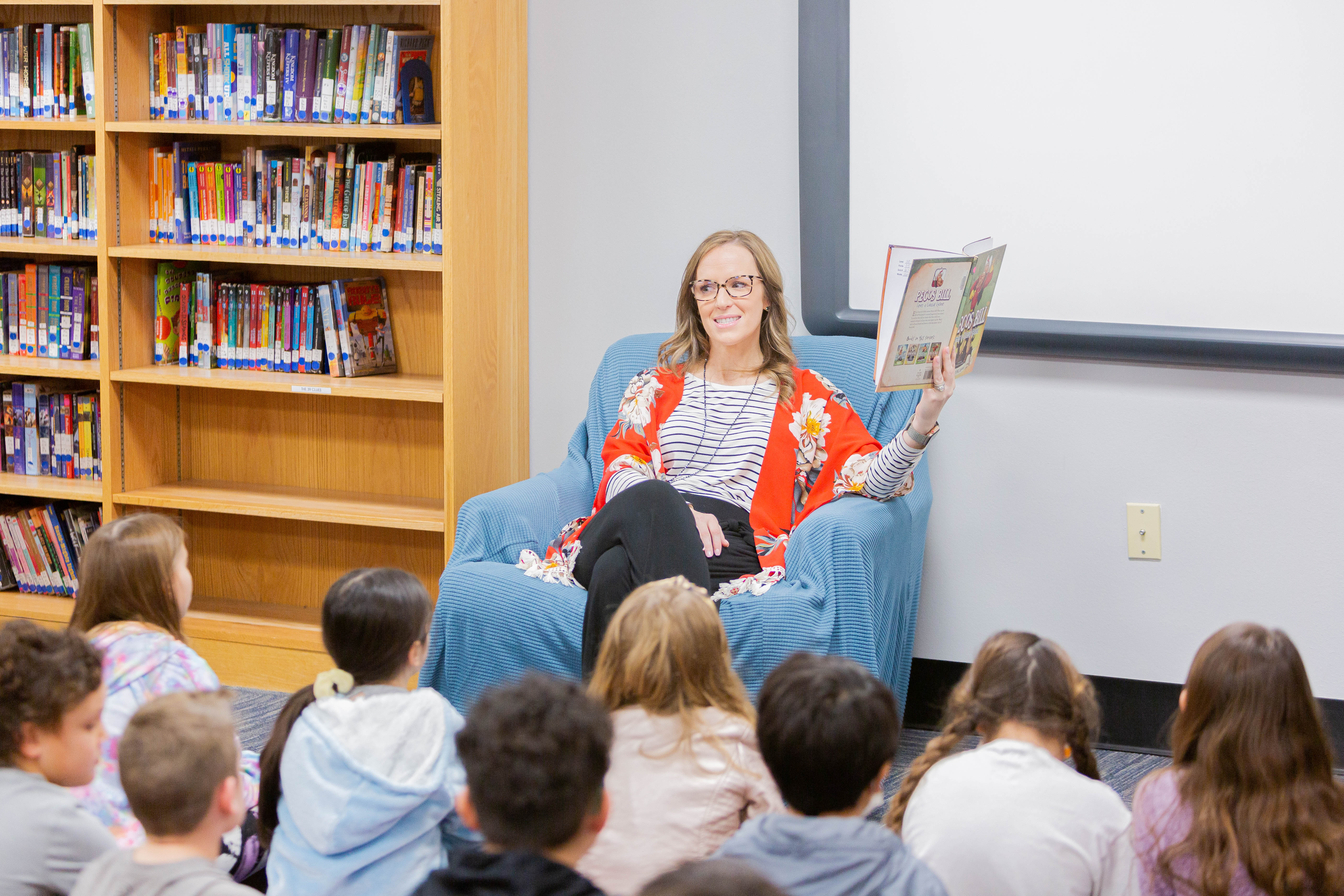 Elementary Teacher reading to her students