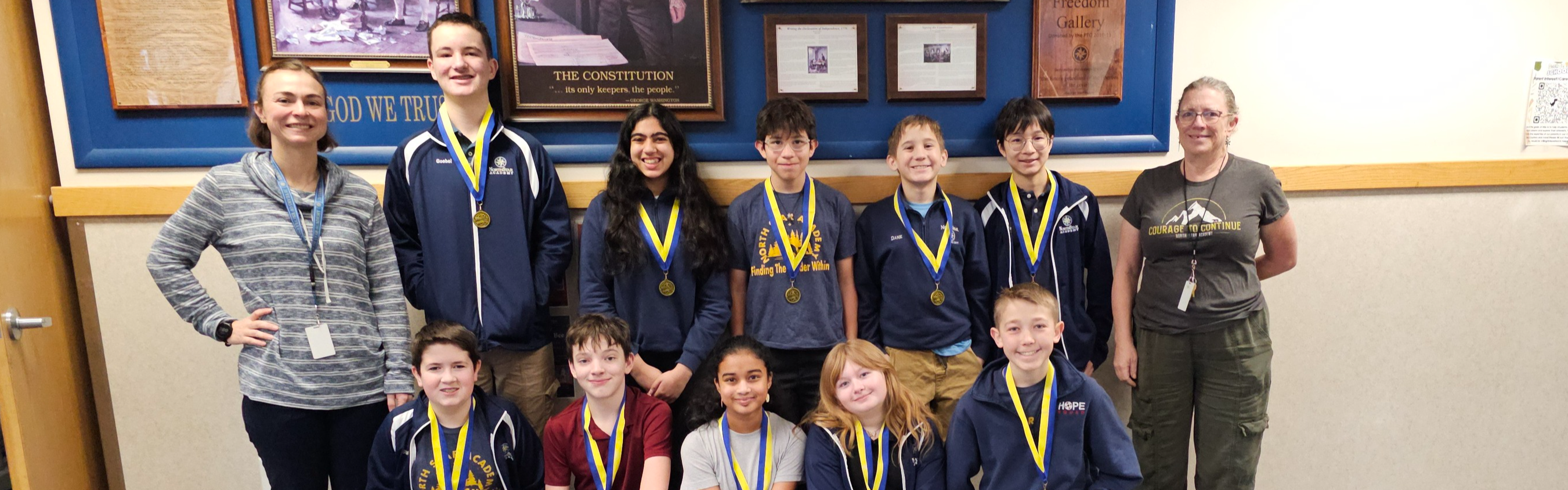 Group of 7th graders with science fair medals.