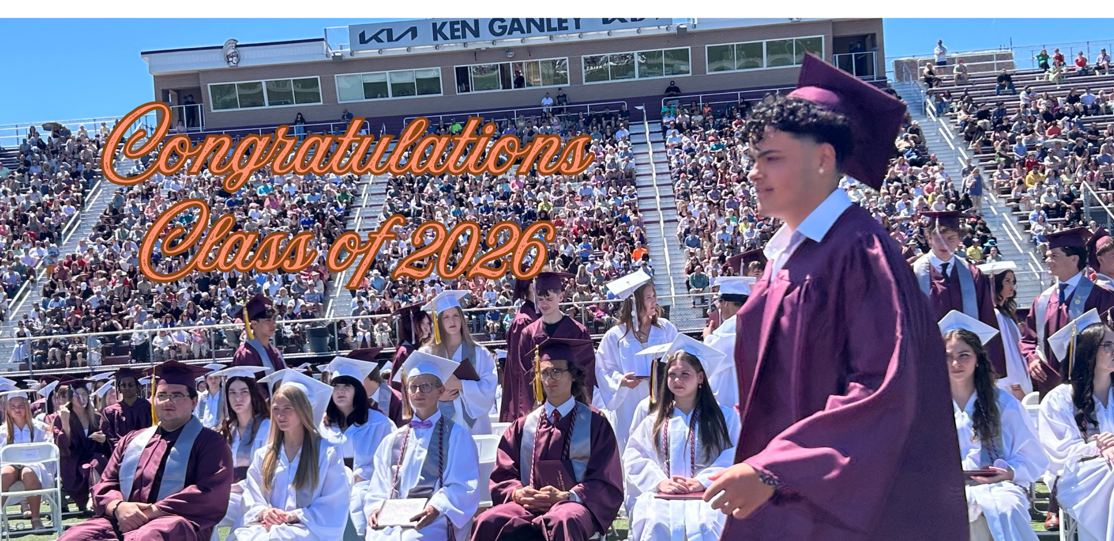 Congratulations Class of 2026 graduate walking past his classmates to get his diploma