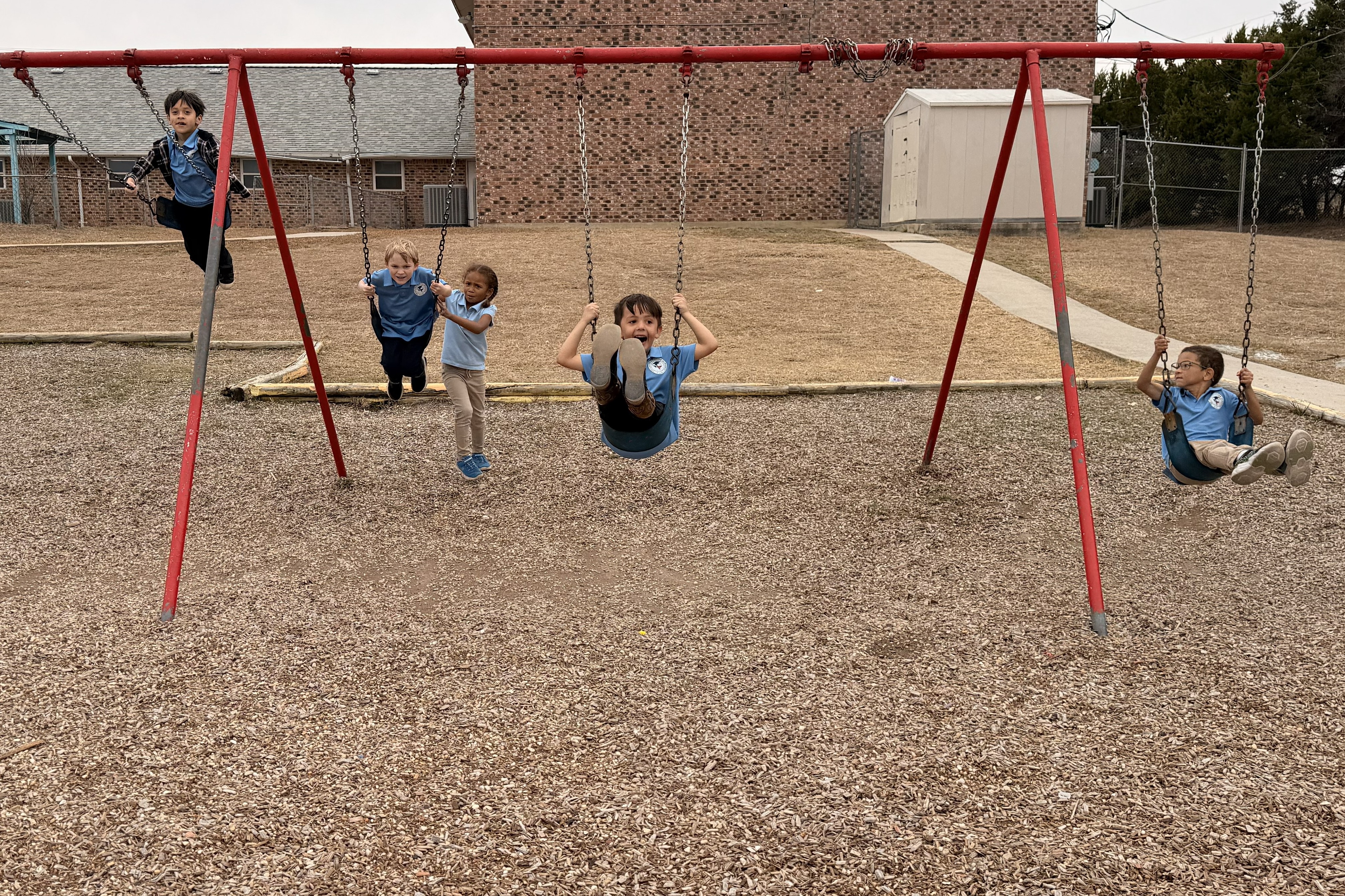 priority charter schools cove swinging at recess