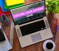 A laptop with the words "Explore your Options"