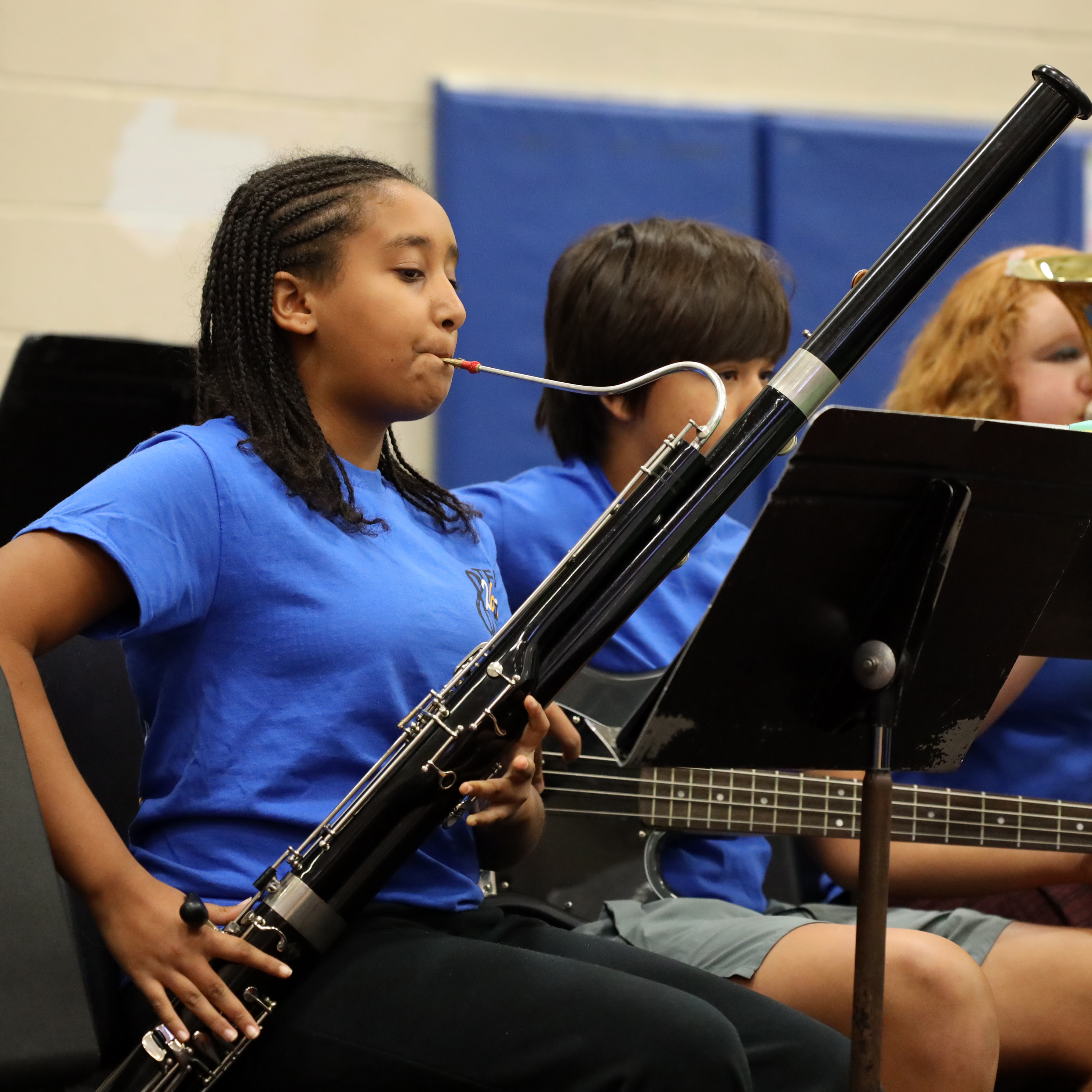 Female student plays basson during performance