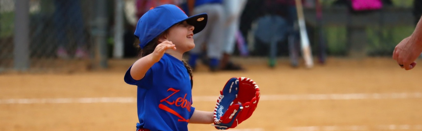 Little girl playing baseball