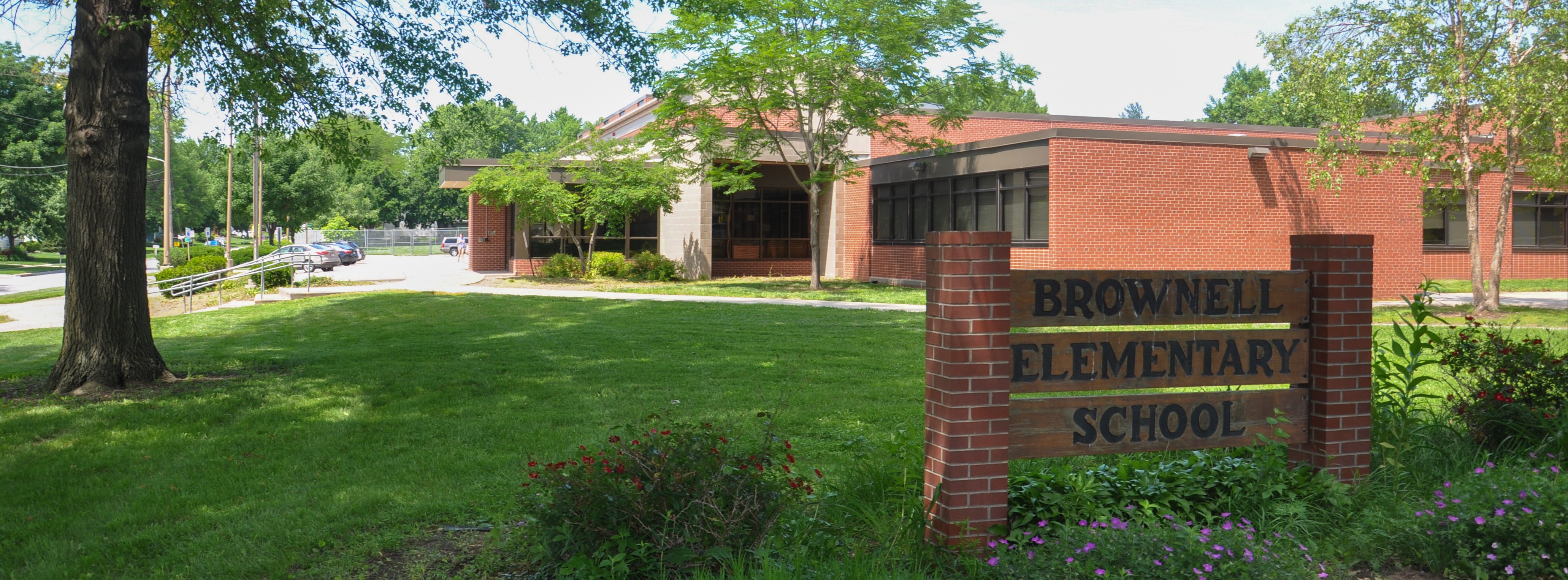 Exterior of Brownell Elementary with their sign in the foreground
