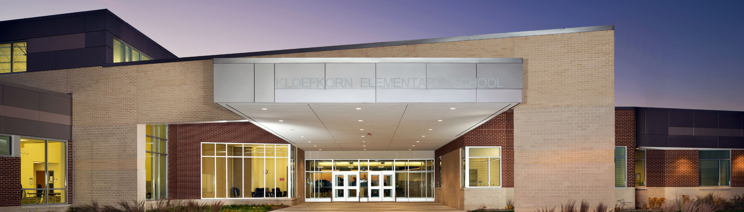 Front entrance of Kloefkorn Elementary at night