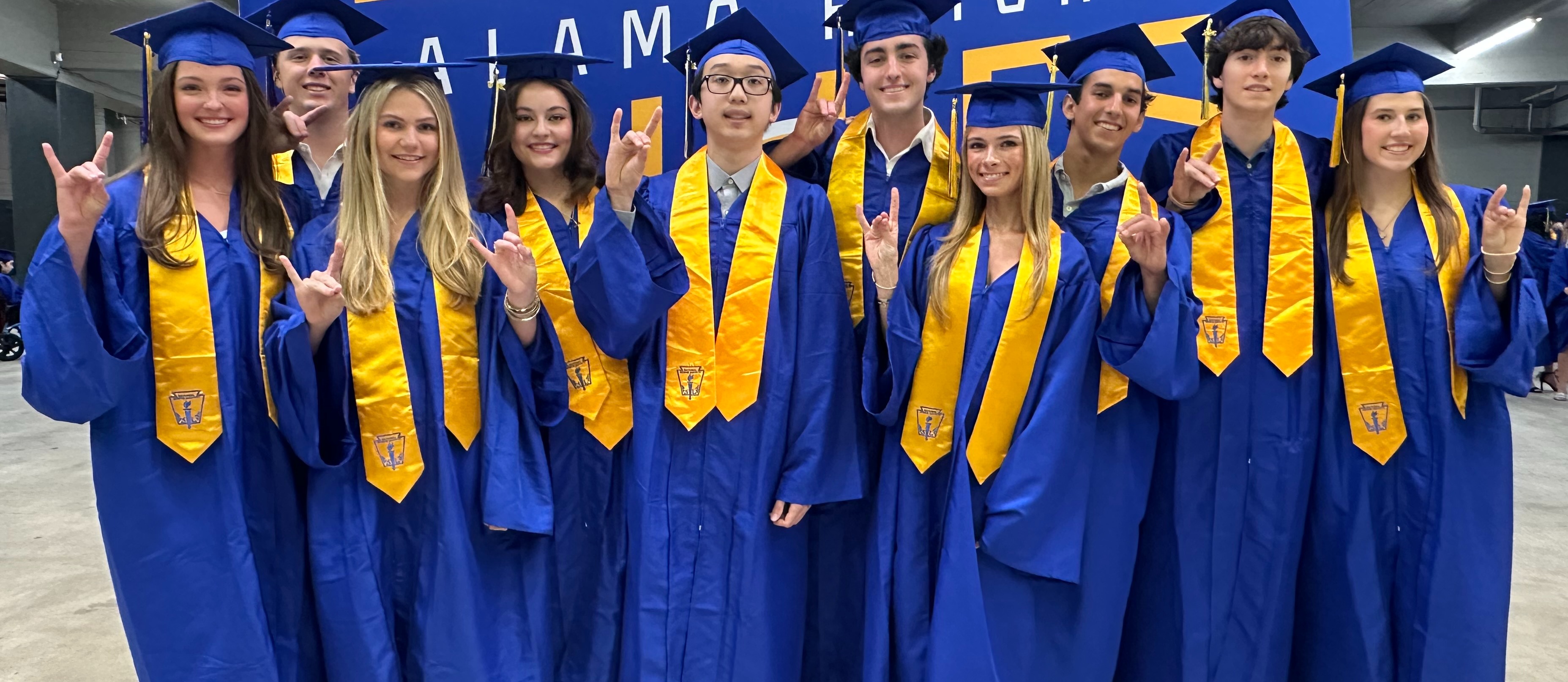Top Ten pose before graduation ceremony