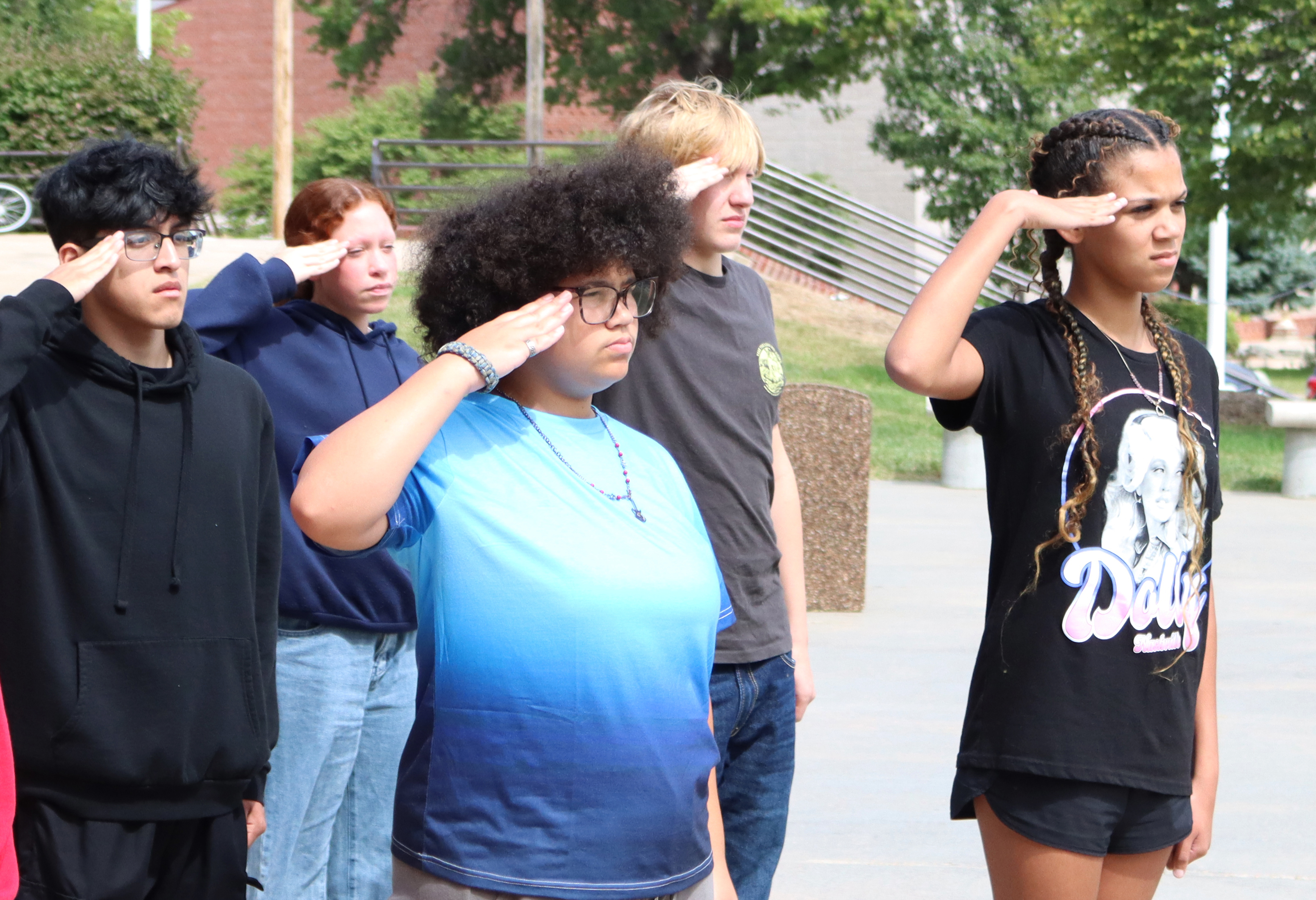 AFJROTC students saluting