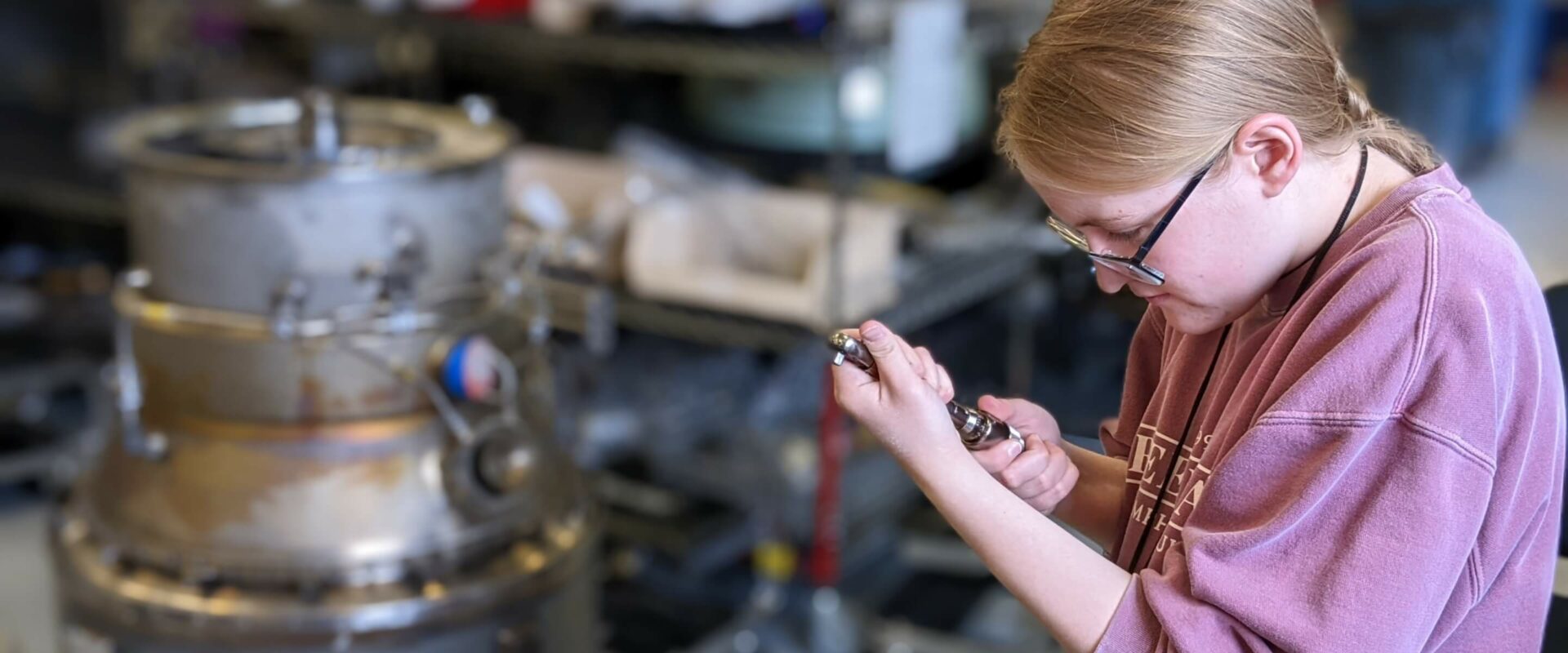 Aviation student working with a torque wrench
