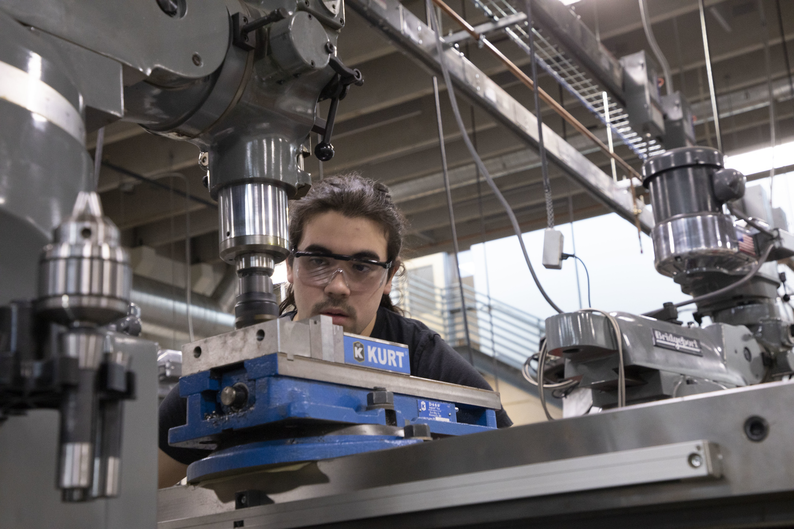TCA student working on a lathe