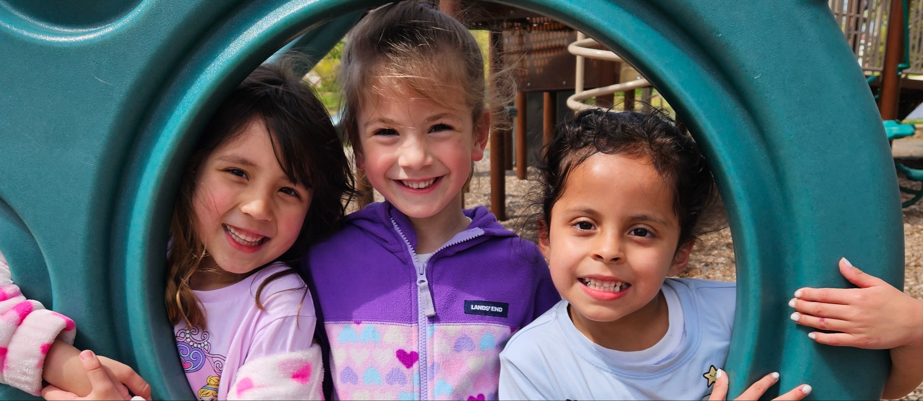 kinders playing on playground