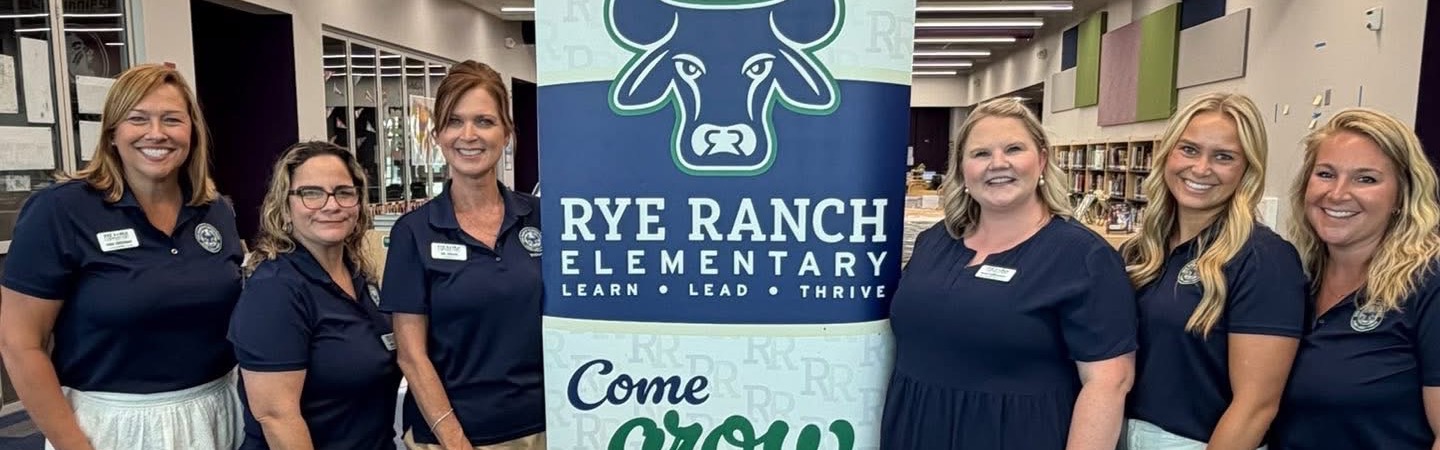 Rye Ranch Leadership Team around banner