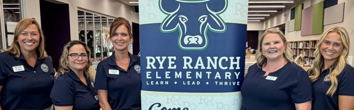 Rye Ranch Leadership Team around banner 