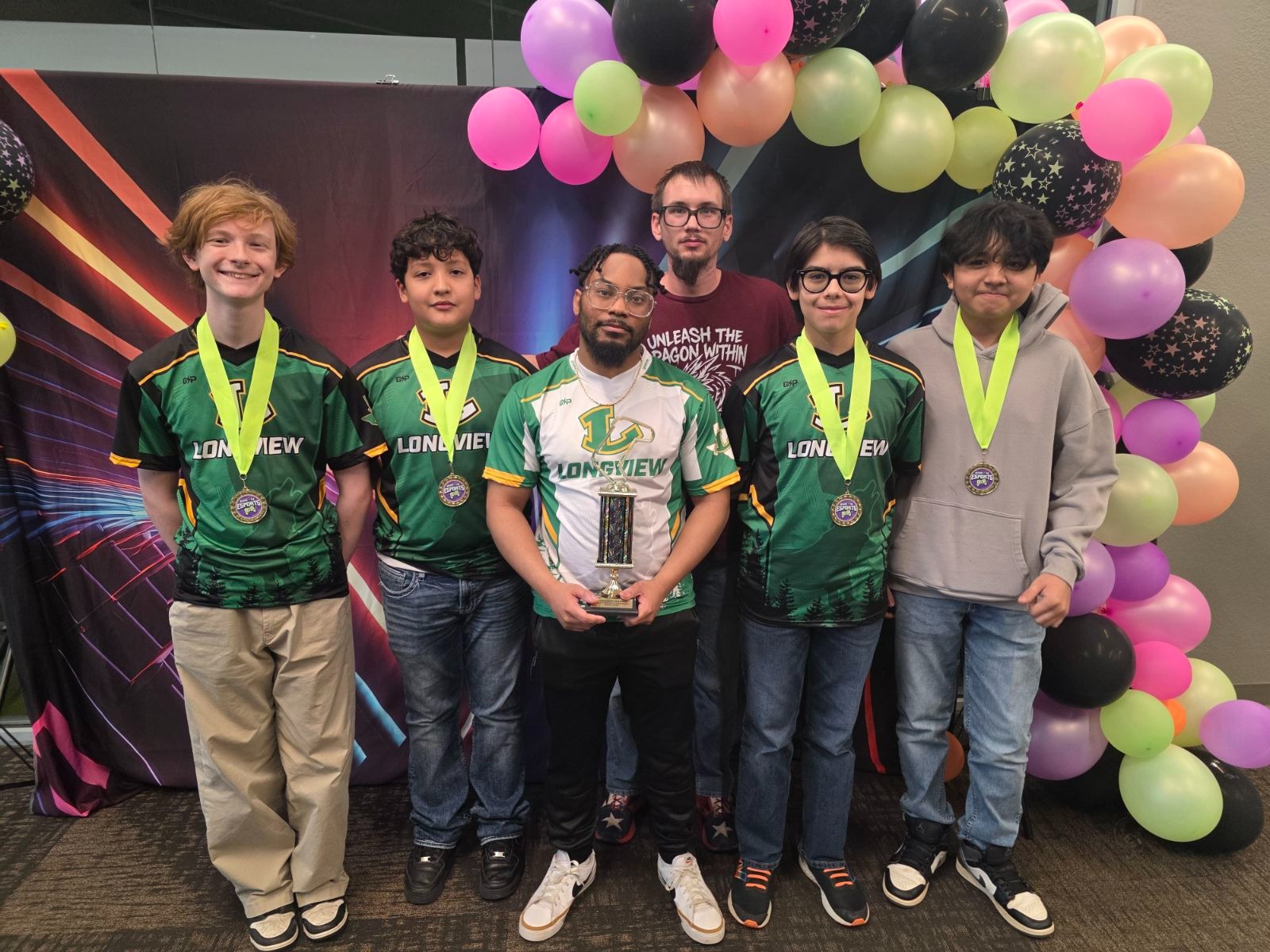 students with trophies