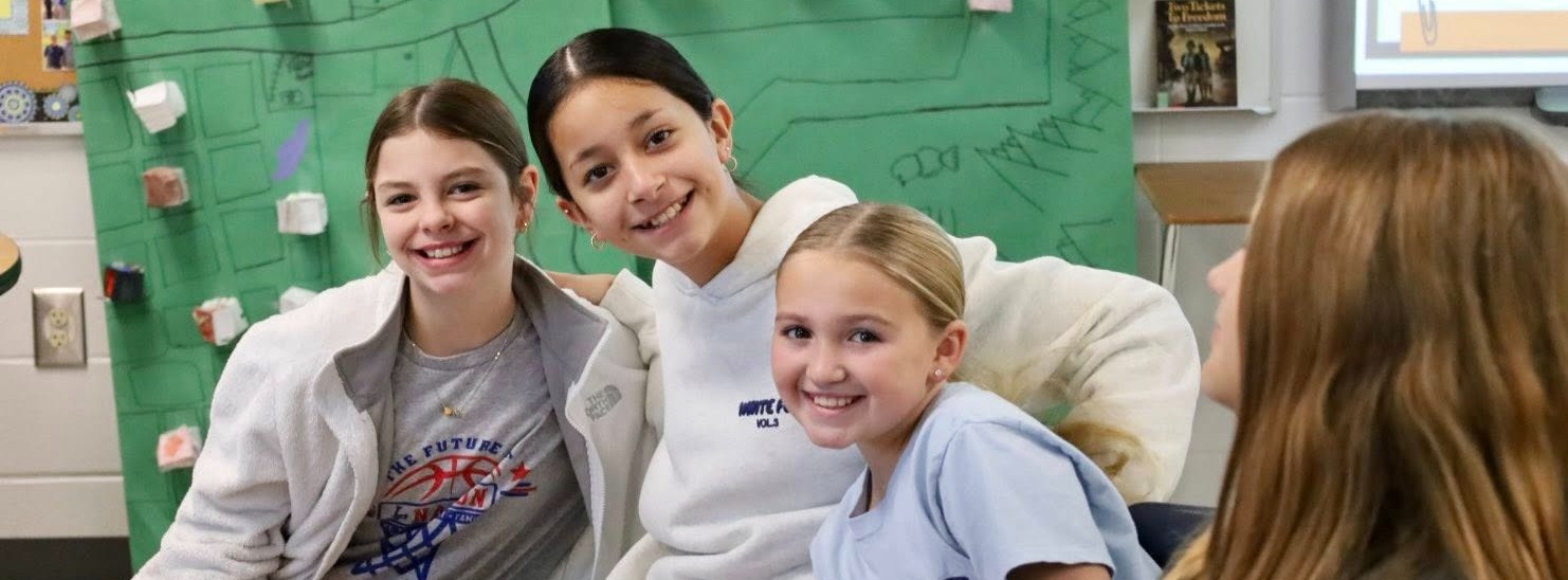 Girls posing in class