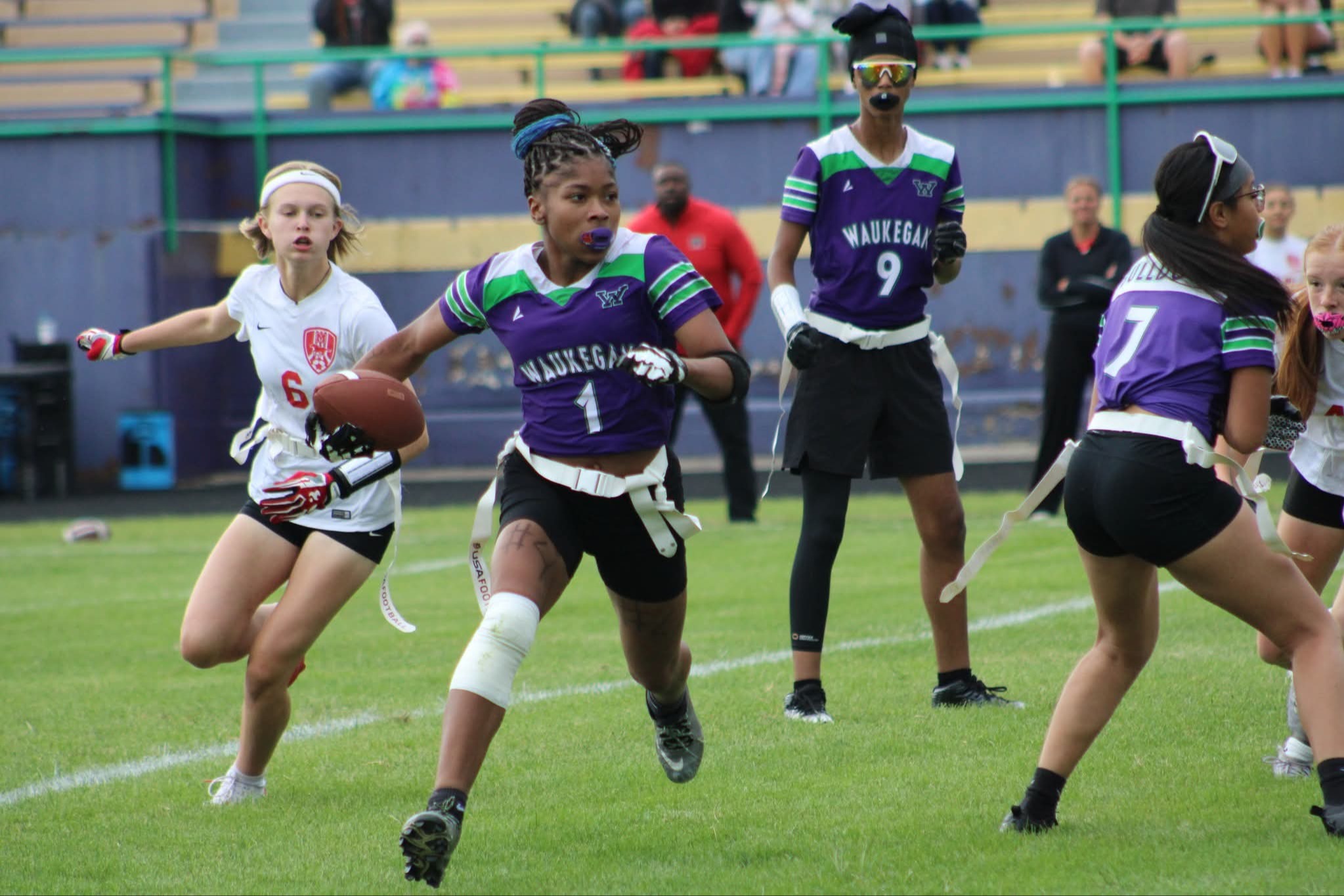 Flag football player running with the ball