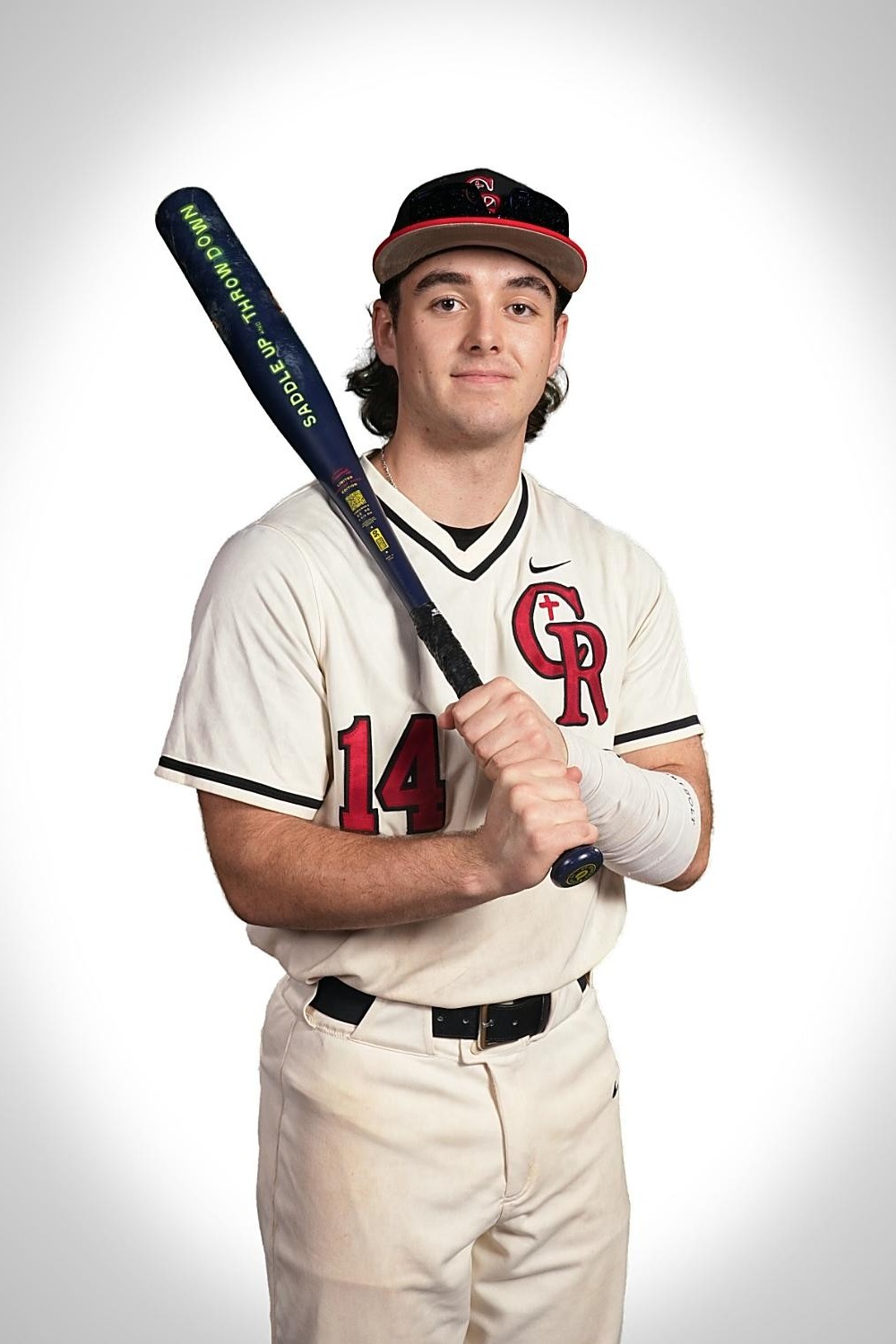 Man in baseball uniform with hat and bat. Number 14 on jersey. Holding bat with left hand. White background.