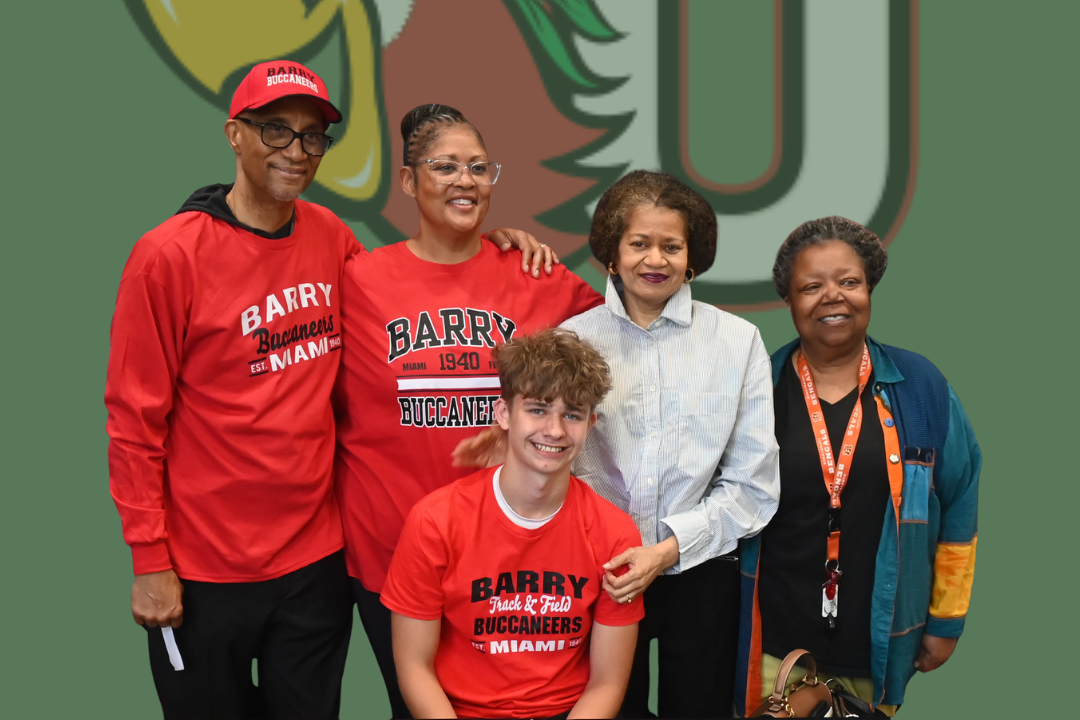 Five people in red, white, and blue clothing standing in front of a green background. The text reads "JaDen Smith Signed Basketball Track & Field".