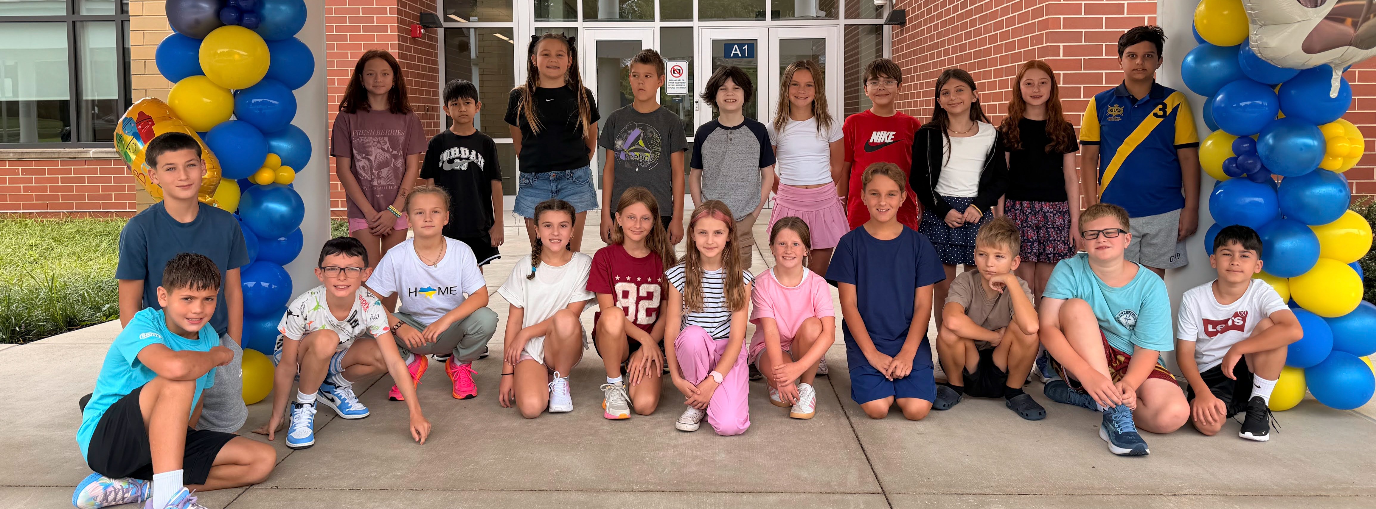 students standing in front of richboro elementary on the first day of school